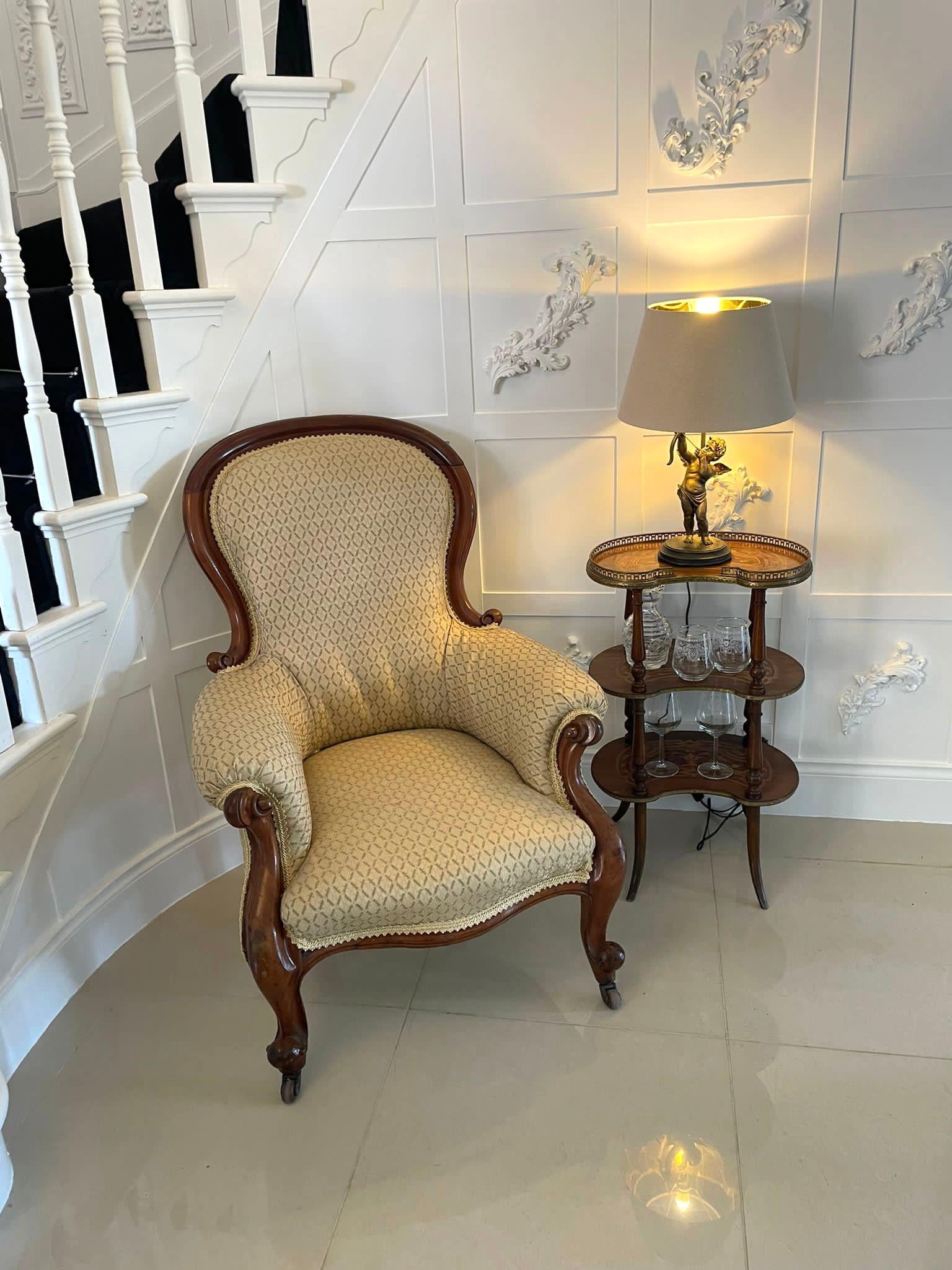 Quality 19th century Victorian antique mahogany armchair which has a pretty shaped mahogany back with decoratively carved scrolled carved arms. It stands on elegant shaped cabriole legs to the front and out swept back legs with the original