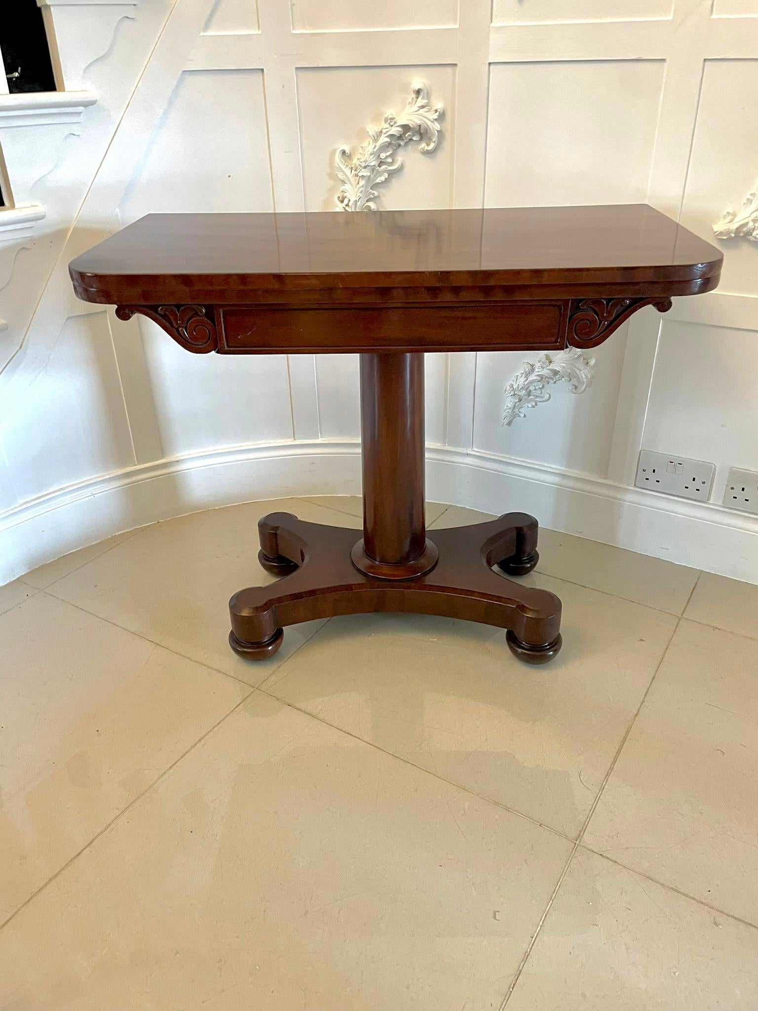 Quality 19th century Victorian antique mahogany card/side table having a lovely mahogany top that lifts up and swivels to reveal a green baize interior, carved frieze supported by a round pedestal finishing on a quatrefoil base with turned feet. It