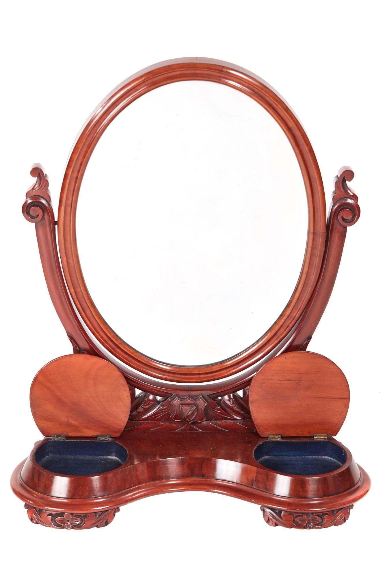 Quality antique Victorian mahogany dressing table mirror, the oval swing mirror with thumb moulded frame supported by lovely carved shaped arms, serpentine shaped base with two lift up compartments, standing on carved feet
Lovely colour and
