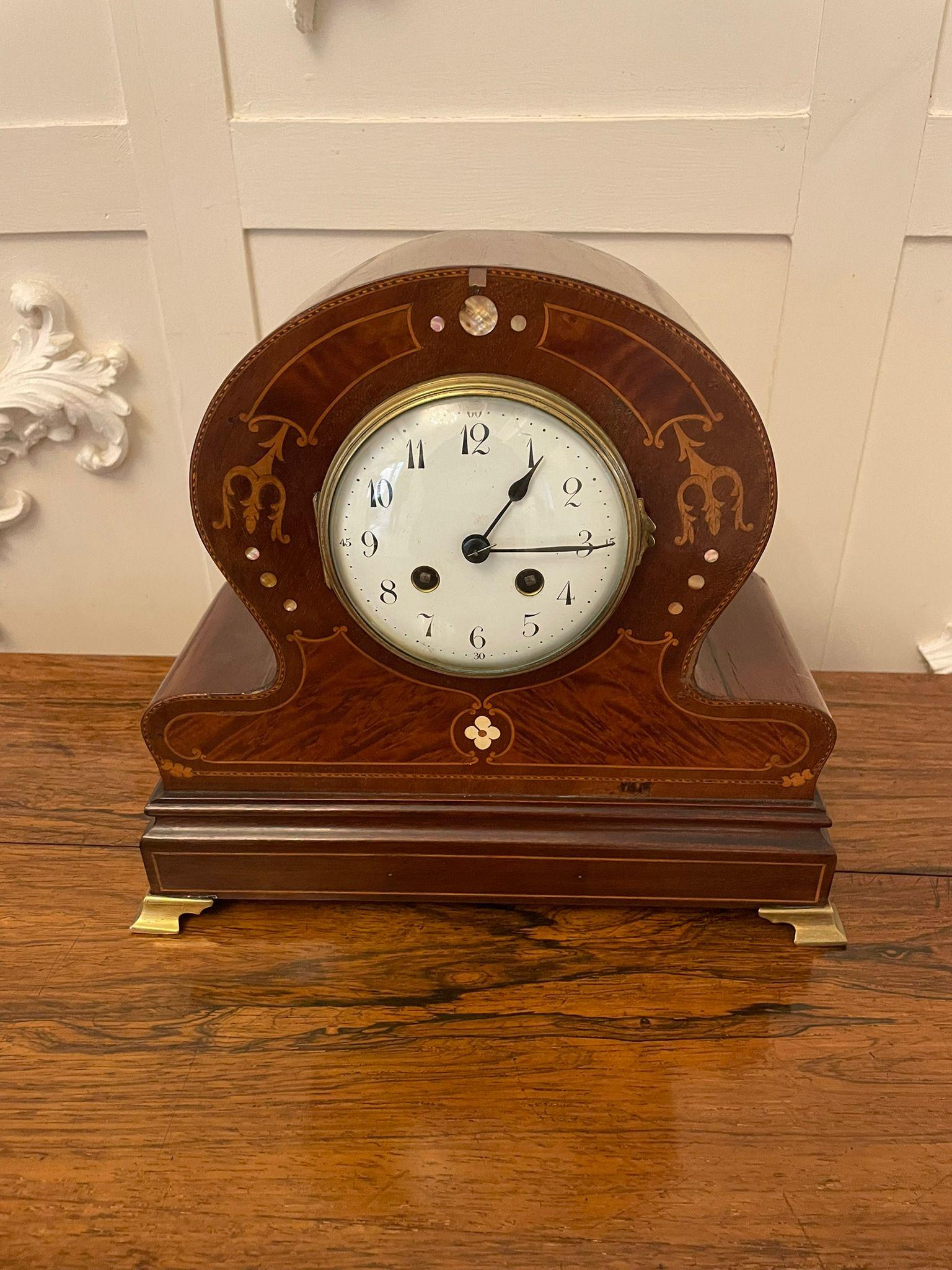 Quality antique Victorian mahogany inlaid mantle clock having a quality porcelain dial with original hands, 8 day movement striking on the hour and half hour on a bell in a fantastic mahogany inlaid shaped case raised on shaped brass feet.

A