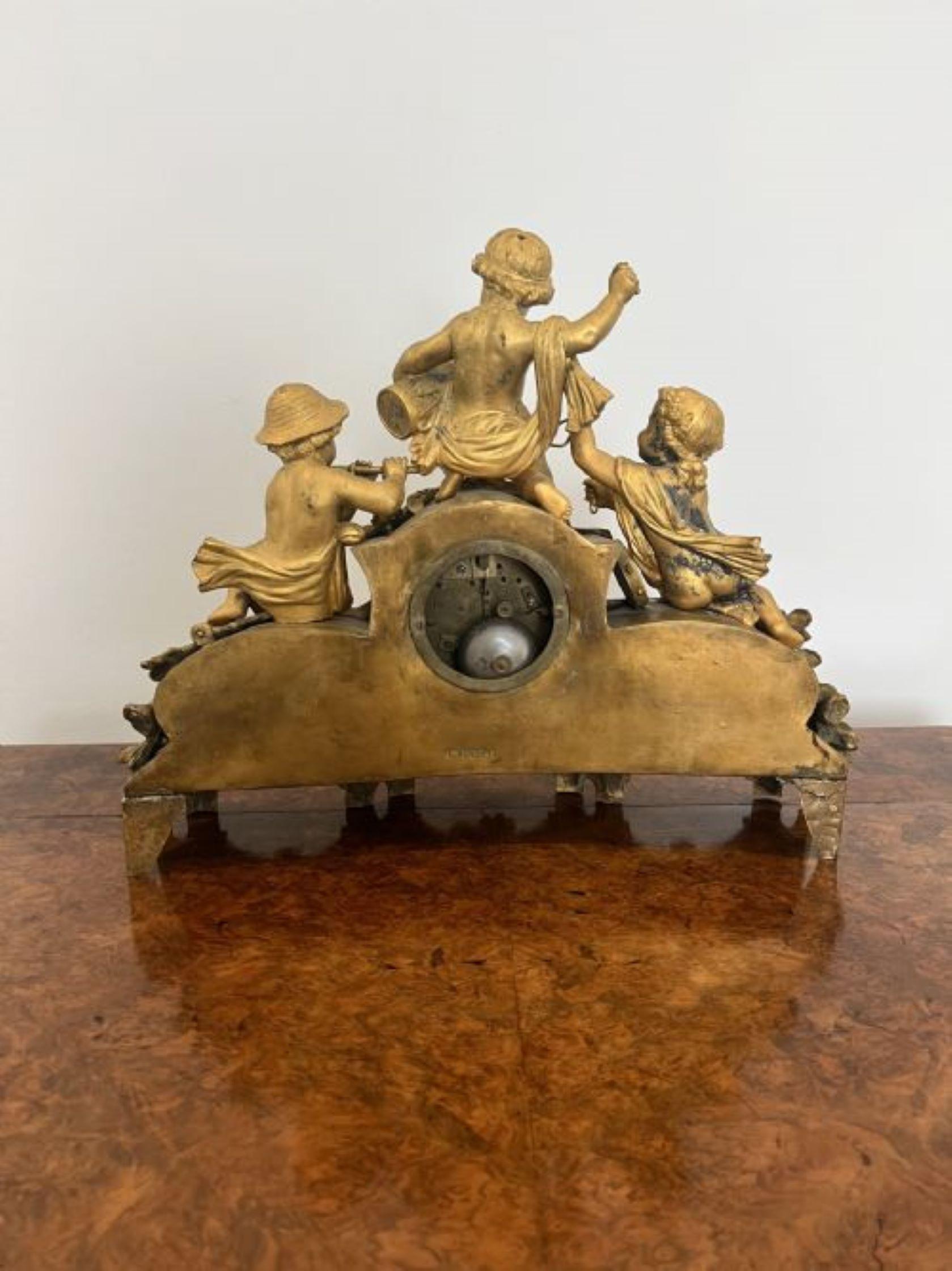 Quality antique Victorian Phillipe H. Mourey French 19th century gilt & Spelter clock having a quality antique Victorian mantle clock with potto playing musical instruments to the top with Sevres panels to both sides with a beautiful porcelain dial