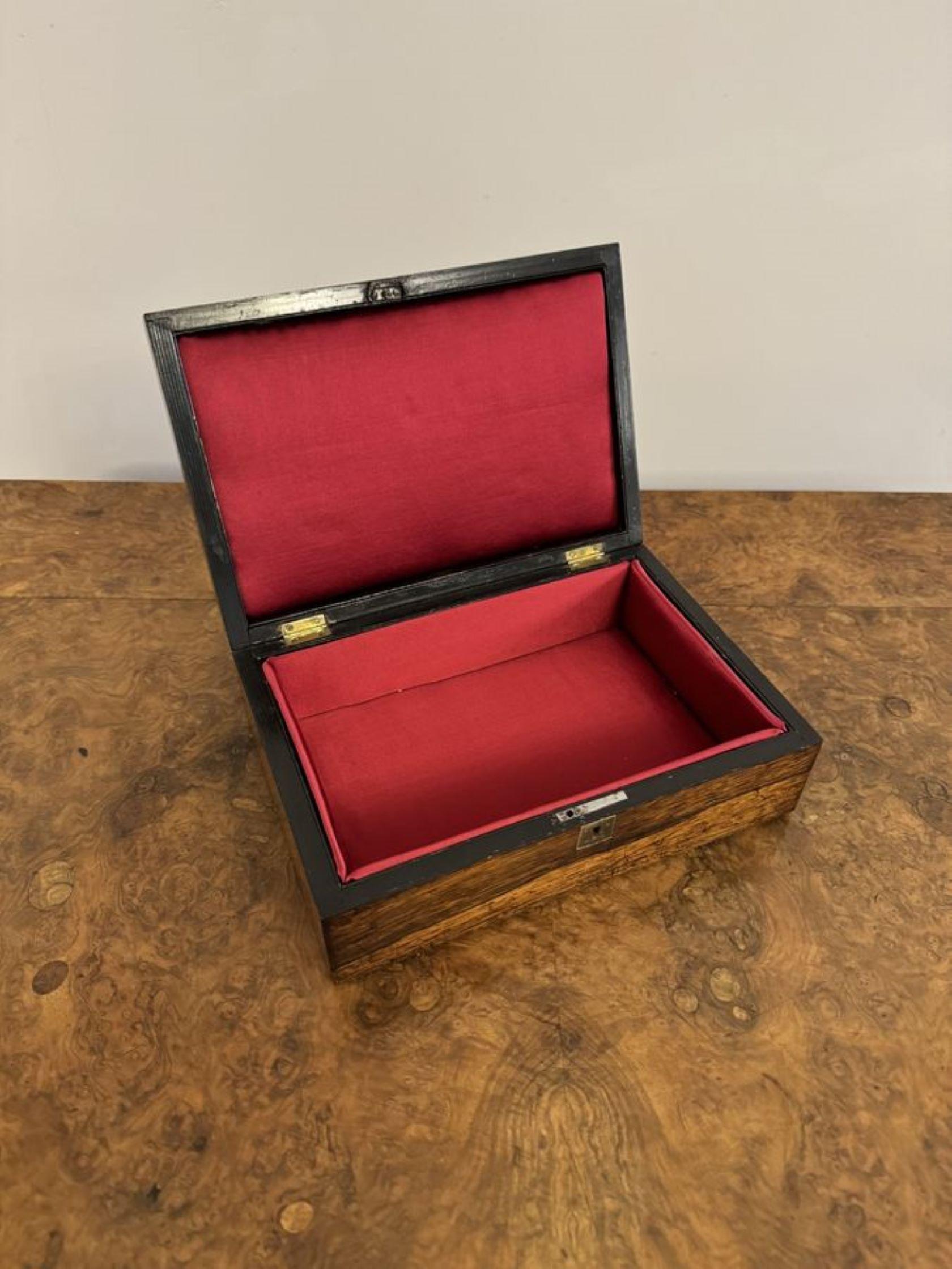 Quality antique Victorian rosewood jewellery box, having a quality antique Victorian rosewood jewellery box with a silver lined border opening to reveal a new fitted red interior.

D. 1860