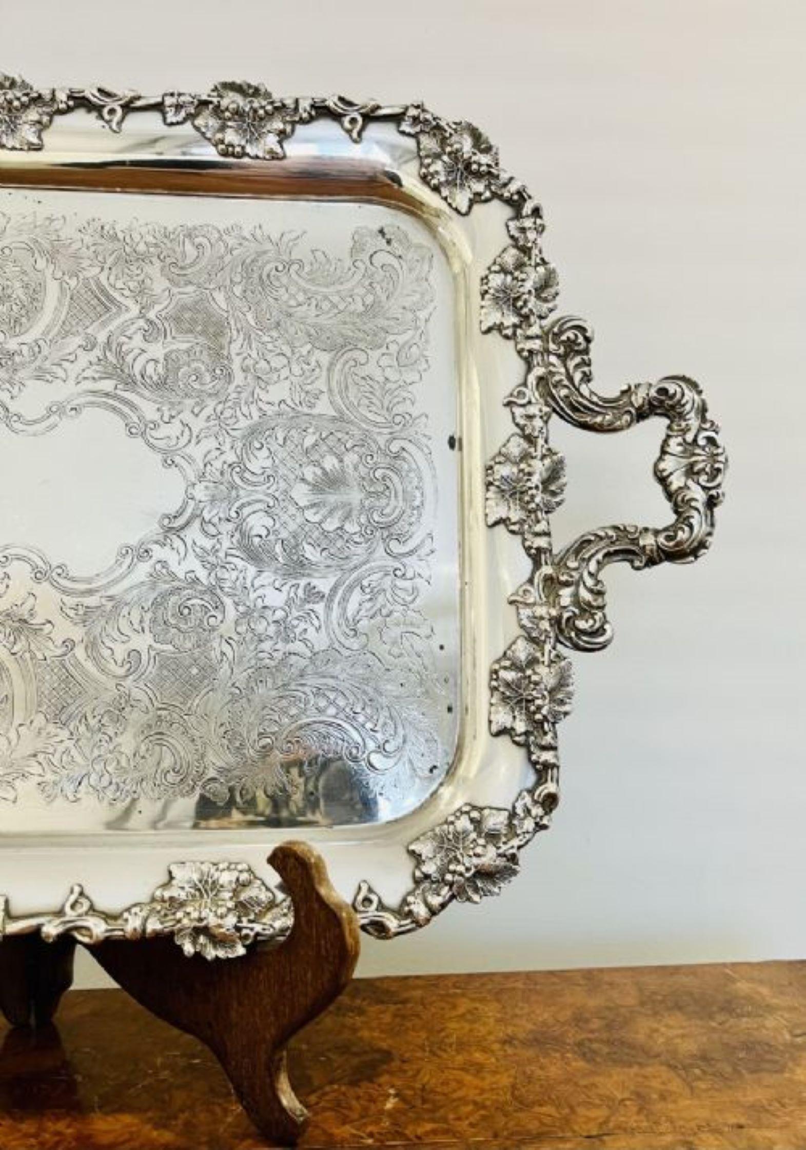 Quality antique Victorian silver plated ornate serving tray having a quality large serving tray with relief decoration with trailing vines and two ornate carrying handles to both sides 