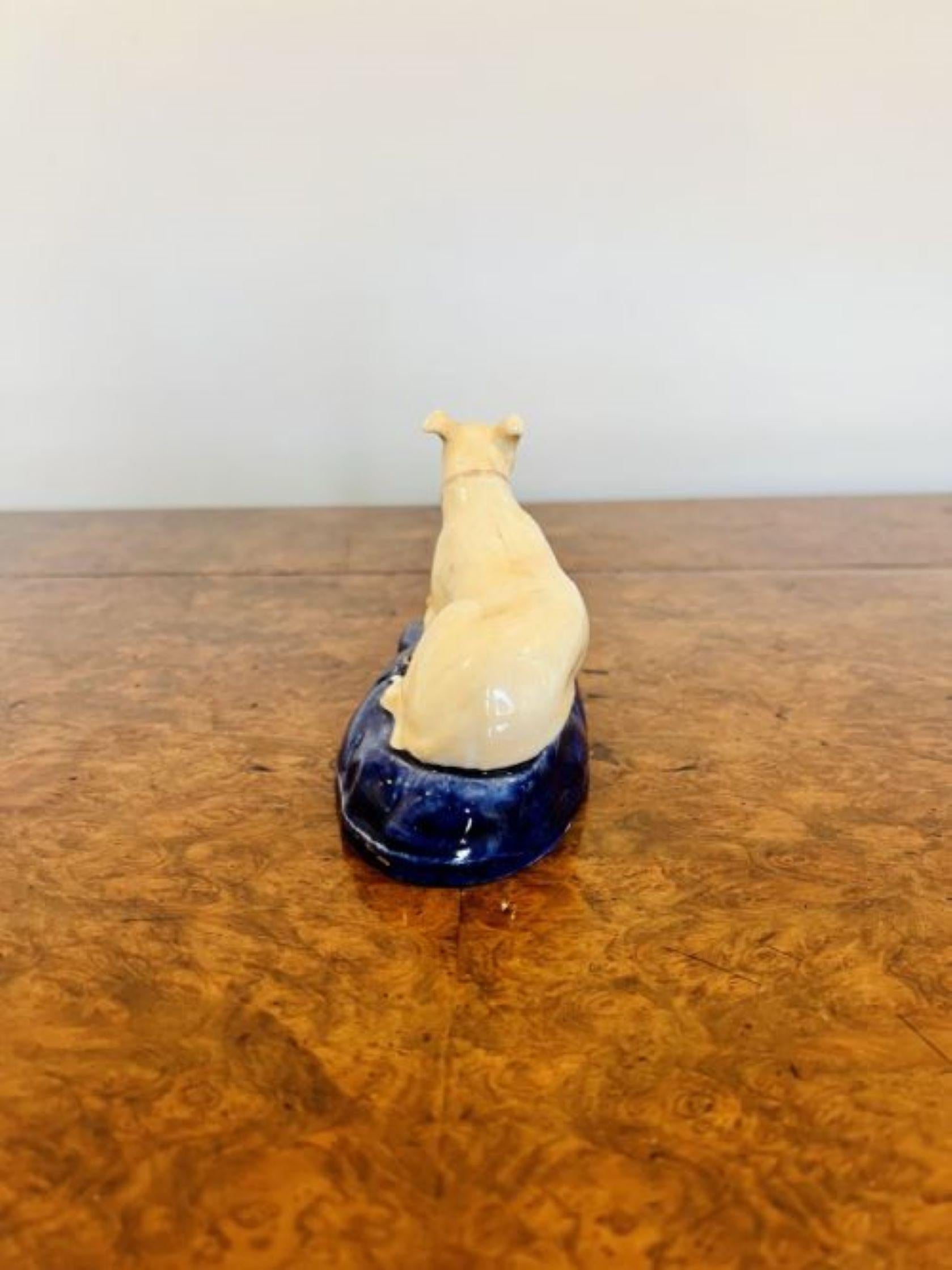Quality antique Victorian Staffordshire Greyhound inkwell having a greyhound laying on a shaped blue coloured base, hand painted in wonderful blue and brown colours