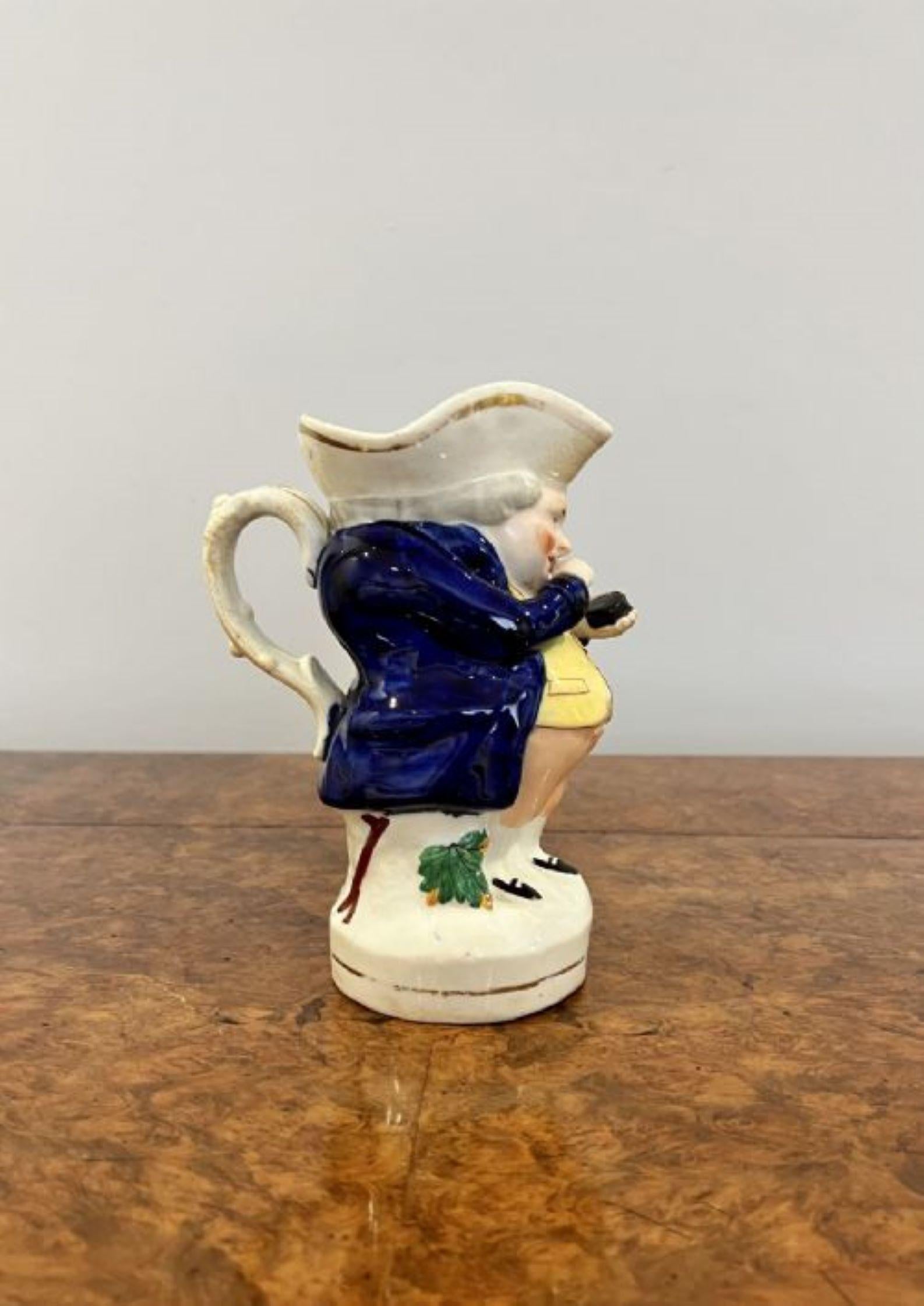Quality antique Victorian Staffordshire toby jug of Mr Snuff having a quality antique Victorian toby jug of Mr Snuff in wonderful period clothing in blue, white, pink, green and black colours with gold gilding having a handle to the back standing on