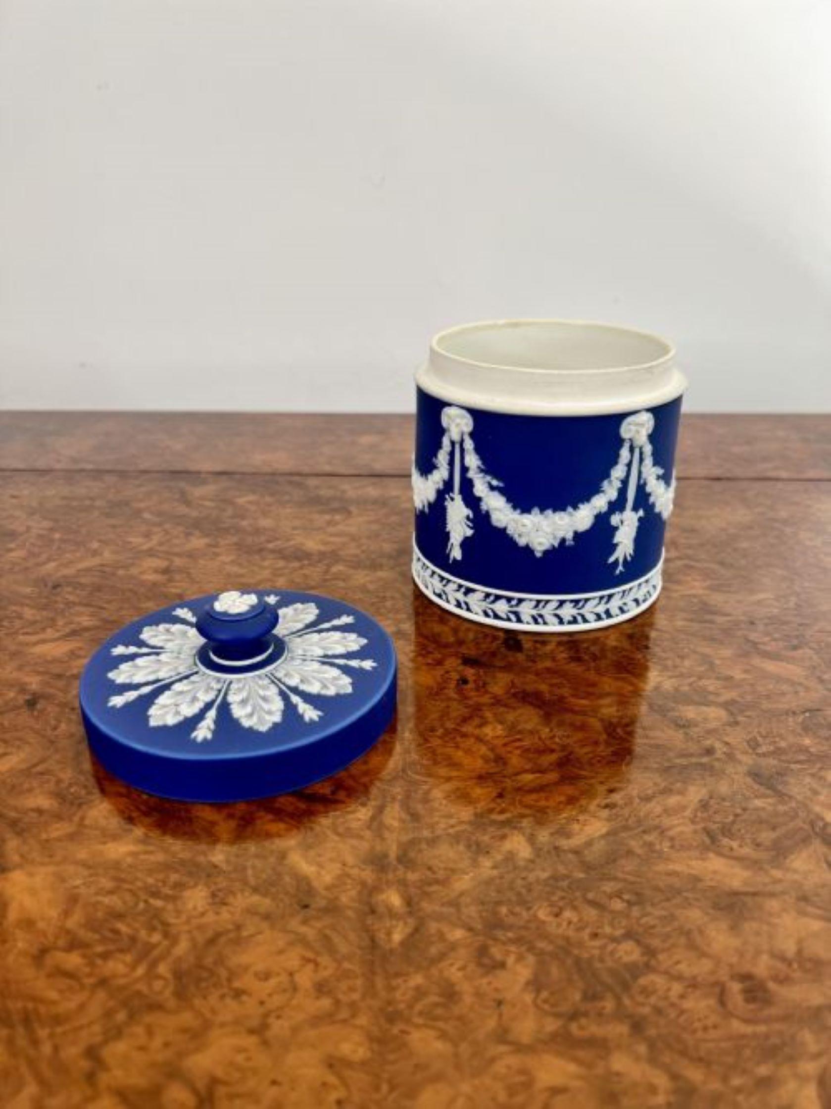 Quality antique Wedgwood jar and cover having a quality antique Jasperware Wedgwood jar and cover with fantastic white enamel decoration on a blue background. 