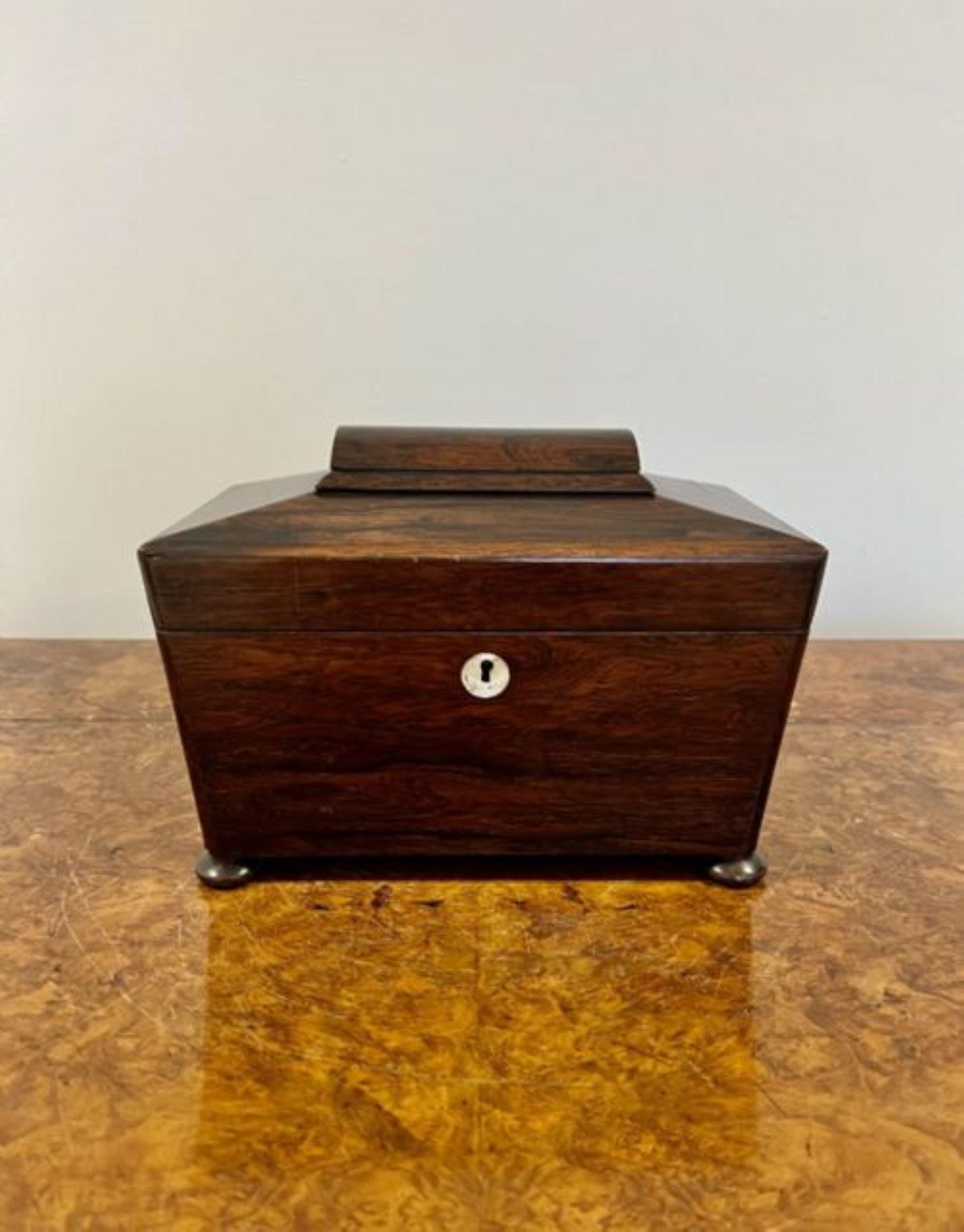 Quality antique 19th Century William IV rosewood tea caddy, having a quality shaped rosewood top opening to reveal a fitted interior of a glass tea mixing bowl and a tea lidded compartment for tea, standing on original bun feet.

D. 1835