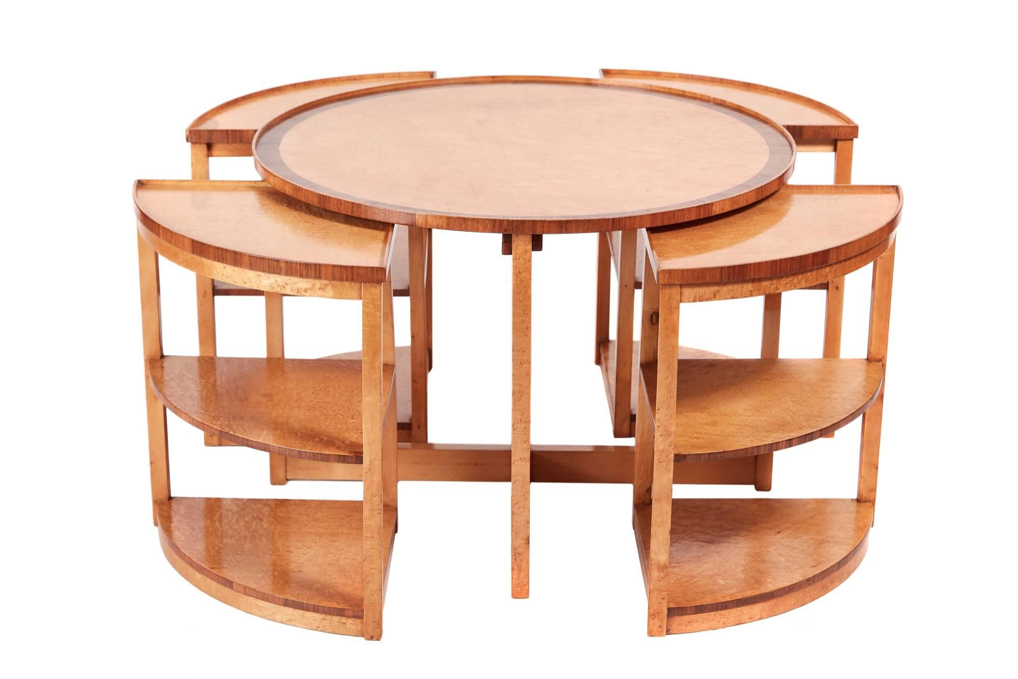 Quality Art Deco bird's-eye maple quartetto nest of tables, with fantastic bird's-eye maple tops crossbanded in walnut, one large round coffee table, four small shaped coffee/lamp tables, all in fantastic bird's-eye maple, standing on plinth