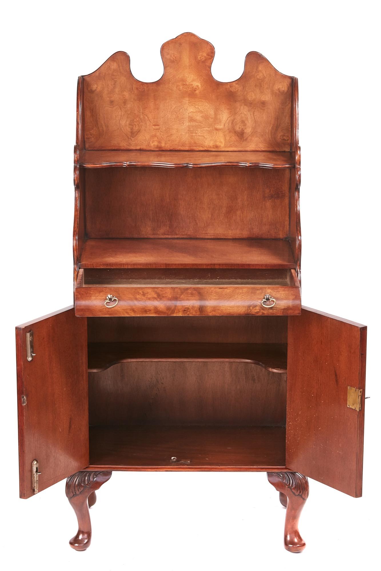 Quality burr walnut near pair of side cabinets, having lovely shaped backs, fitted shelf, one long shaped drawer with original brass handles, two burr walnut cupboard doors, standing on shaped carved cabriole legs
Lovely color and