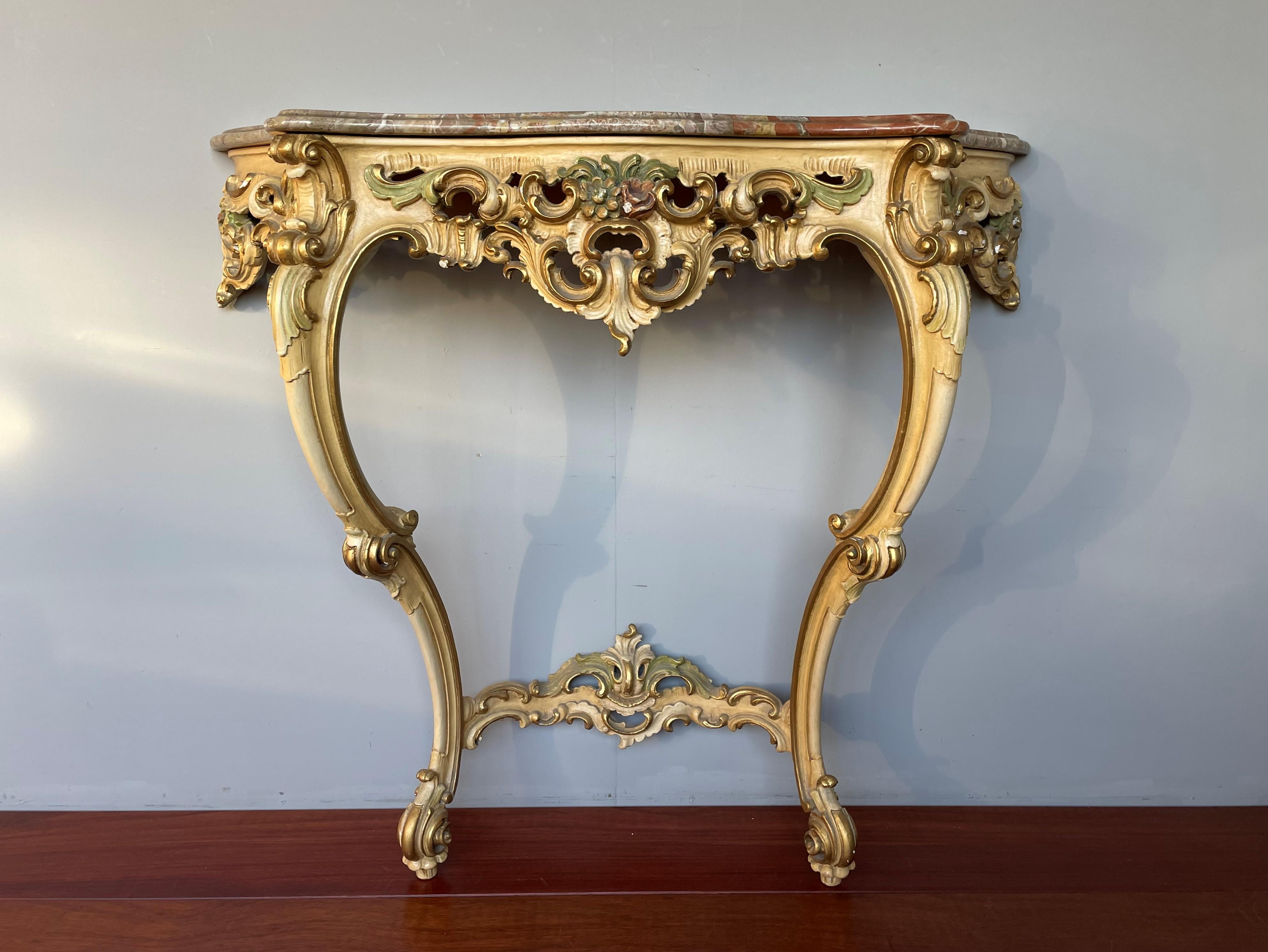 Beautifully handcrafted and wonderfully sculptural Venetian sidetable with rare colors marble top.

This semi antique and finer quality carved side table comes with a stunning and mint condition, 'curvy beveled' marble top. The overal design is