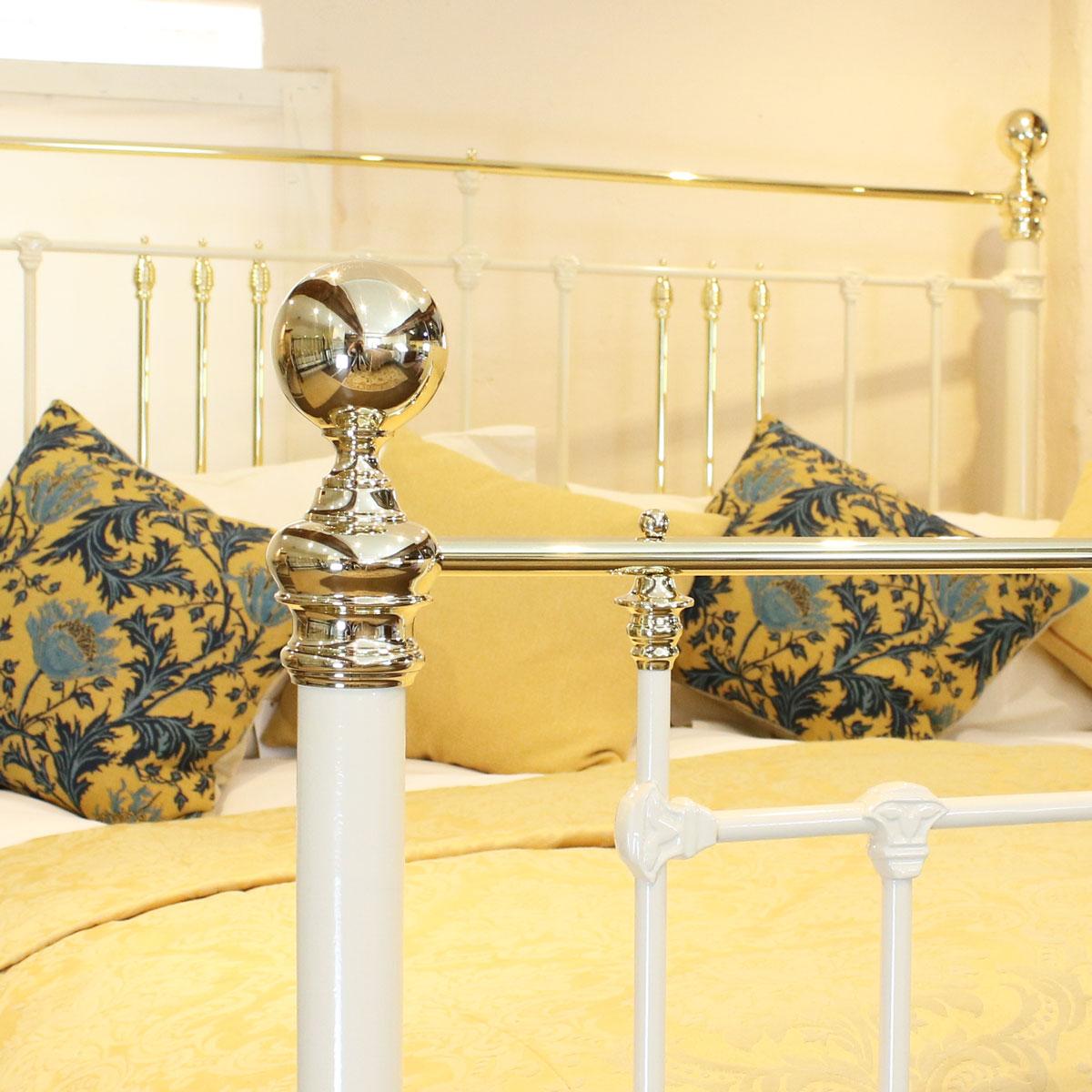 Quality cast iron a brass bed adapted to the 6'0 width from an original Victorian frame, circa 1890. It features a superb brass Art Nouveau plaque in the center of the foot panel and also brass 