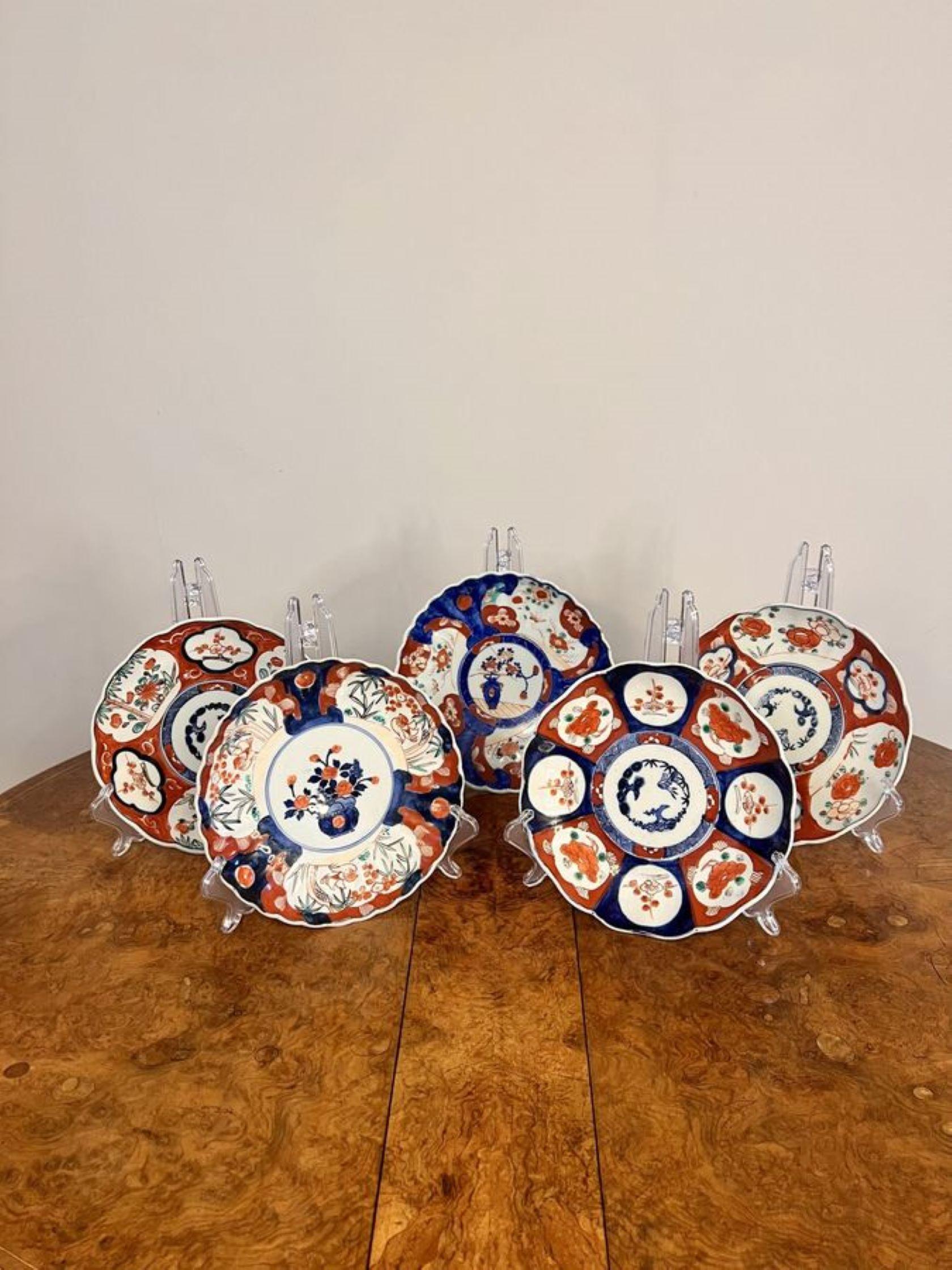 Quality collection of five antique Japanese imari plates having five antique Japanese imari plates all with lovely individual patterns decorated with flowers, trees, leaves, birds, fish and scrolls hand painted in wonderful red, blue, green, and