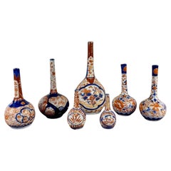 Quality collection of seven antique Japanese imari shaped vases