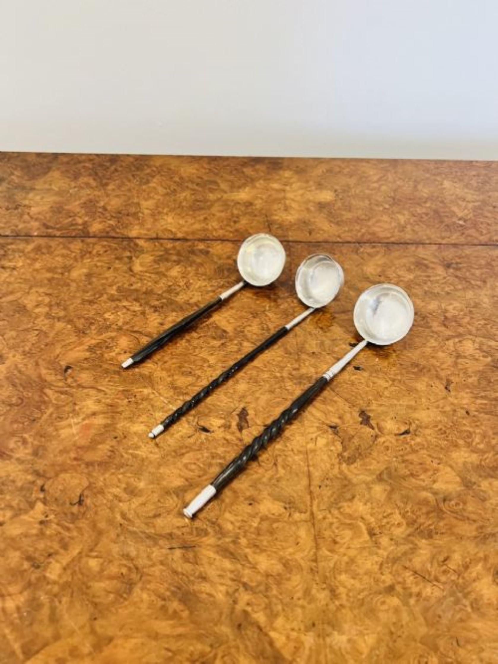 Quality collection of three antique George III ladles having a quality collection of three George III ladles, having solid silver tips and ladle with rope twist whale bone handles. 