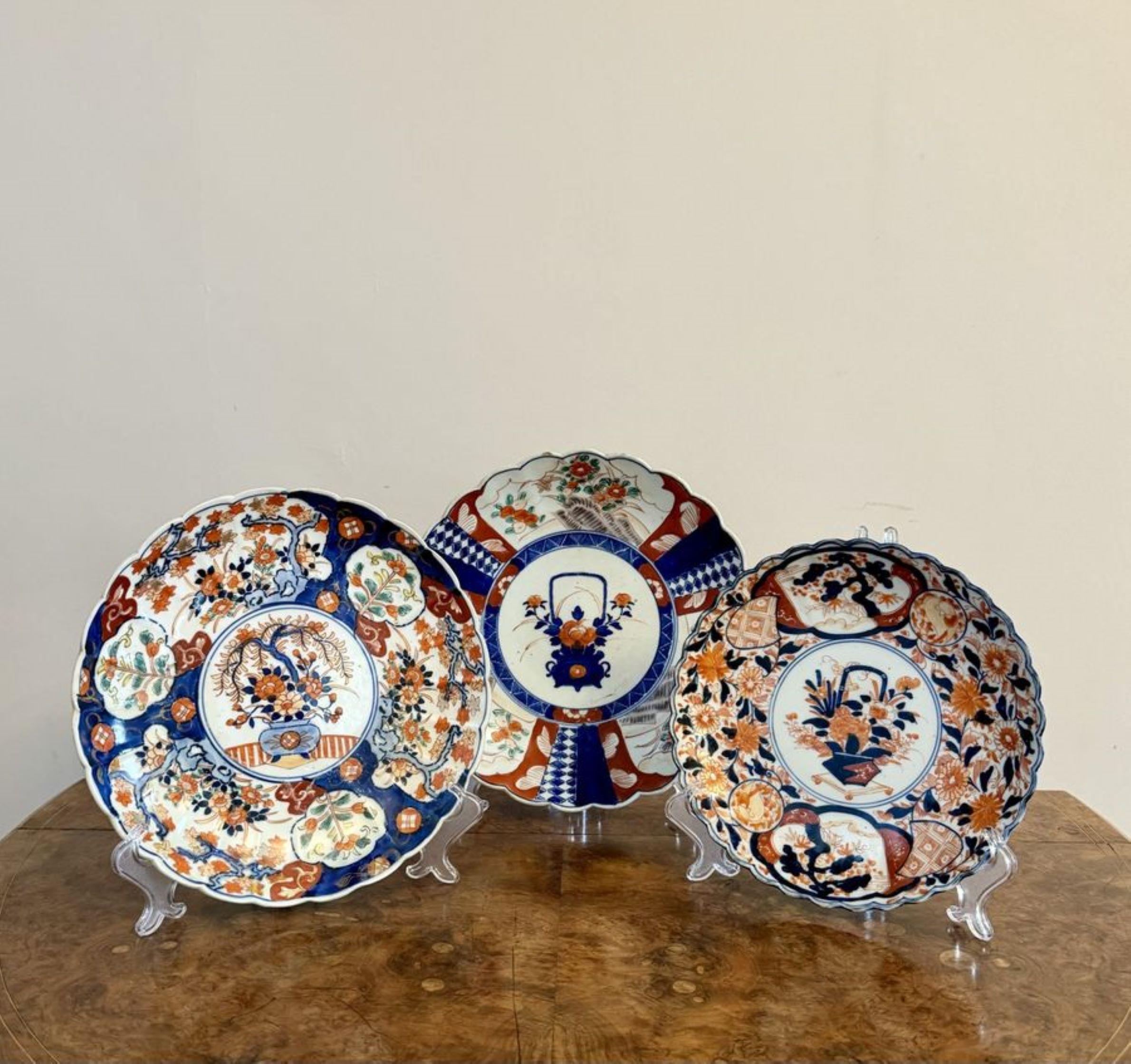 Quality collection of three large antique Japanese imari plates, having three quality large antique Japanese imari plates decorated with flowers, trees, leaves and scrolls hand painted in stunning red, white and blue colours.

Largest plate