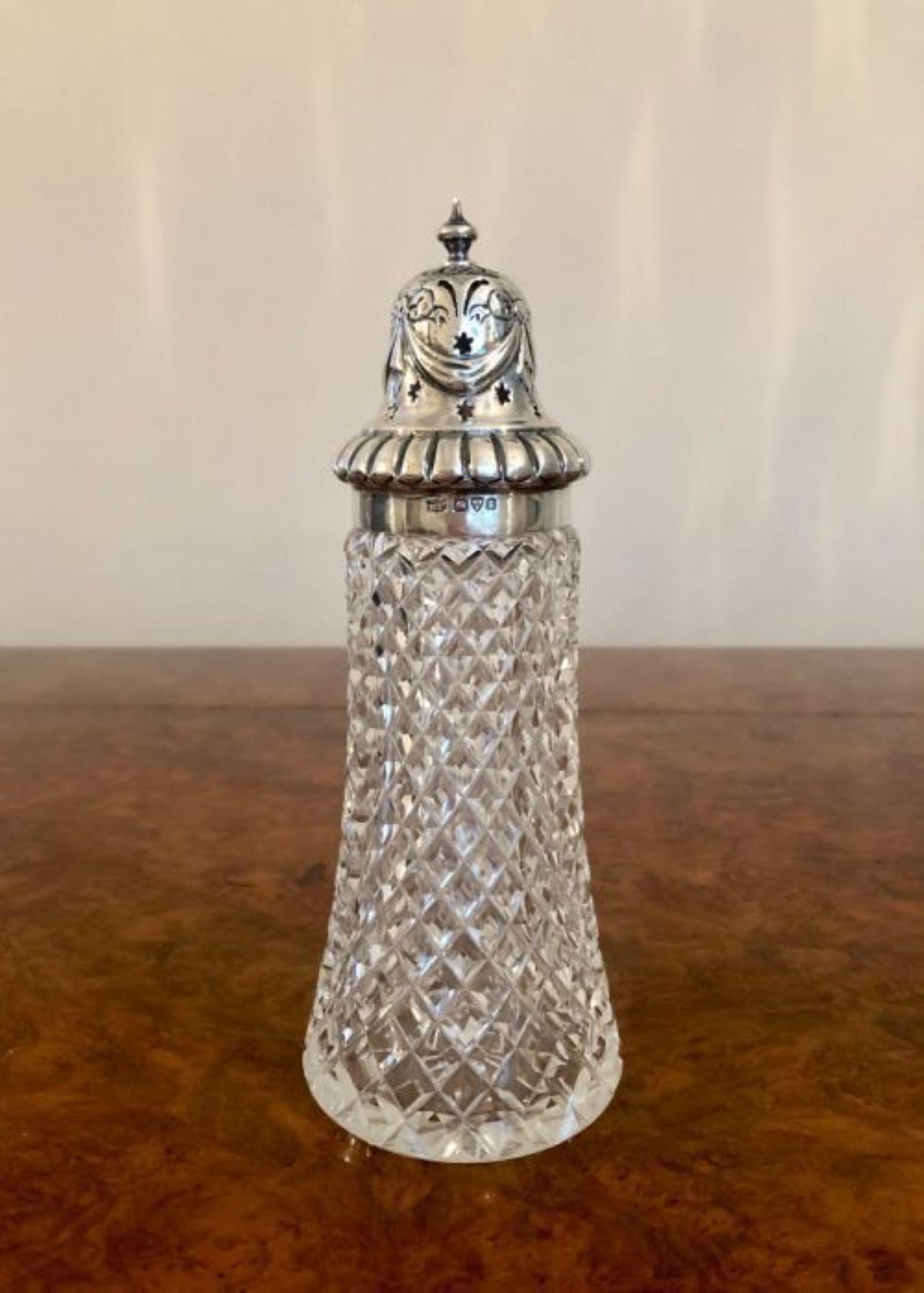 Quality Edward VII solid silver & cut glass sugar caster, having a turned effect finial above a swag, beautiful tied bow & star pierced removable silver hall marked top on top of a cut glass body with a star cut base. 