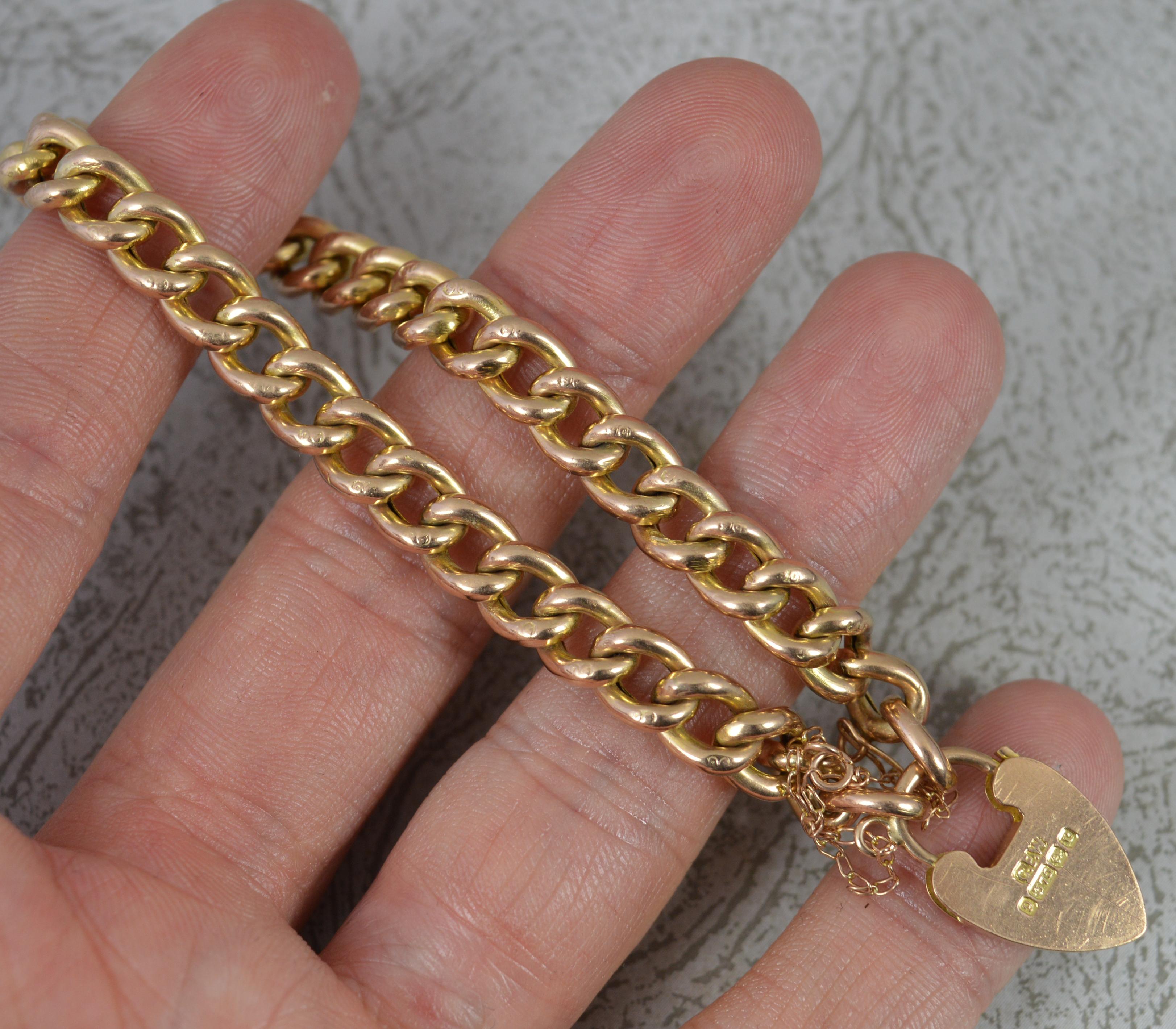 A superb Edwardian era bracelet..
Solid 9 carat gold example.
Well made, plain, polished curb links with 9c to each link. Complete with a working padlock clasp and safety chain.

CONDITION ; Very good for age. Working clasp. Crisp design and links.