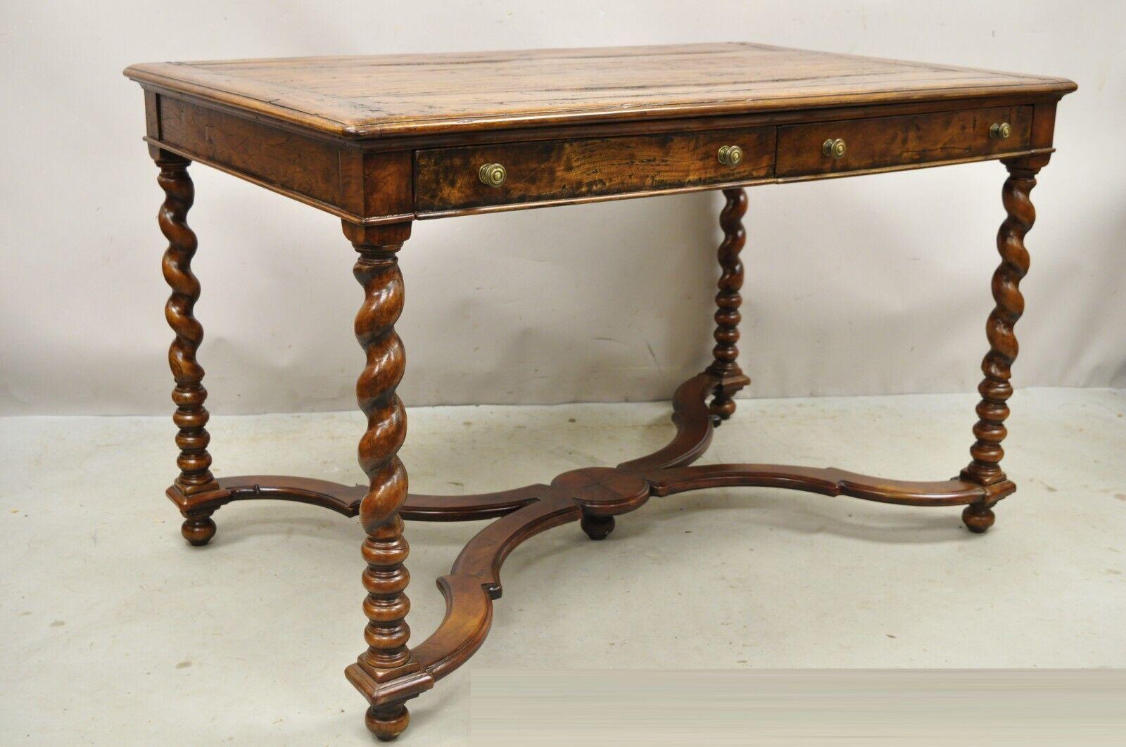 Quality English Louis XIII Style Walnut 2 Drawer Desk Table with Spiral Legs. Item features a magnificent antiqued/aged finish, turn carved spiral legs, carved stretcher base, solid wood construction, beautiful wood grain, 2 dovetailed drawers, very