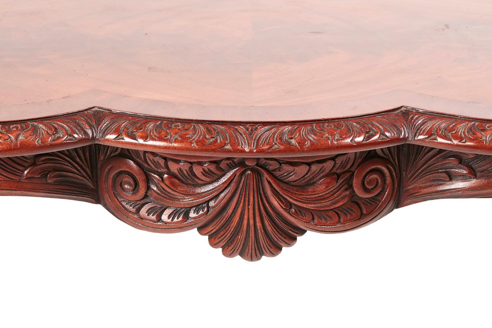 Quality freestanding carved mahogany centre table, having a lovely crossbanded mahogany top with a carved edge, carved frieze, standing on four carved shaped cabriole legs with pad feet.
Lovely color and condition.
Measures: 46