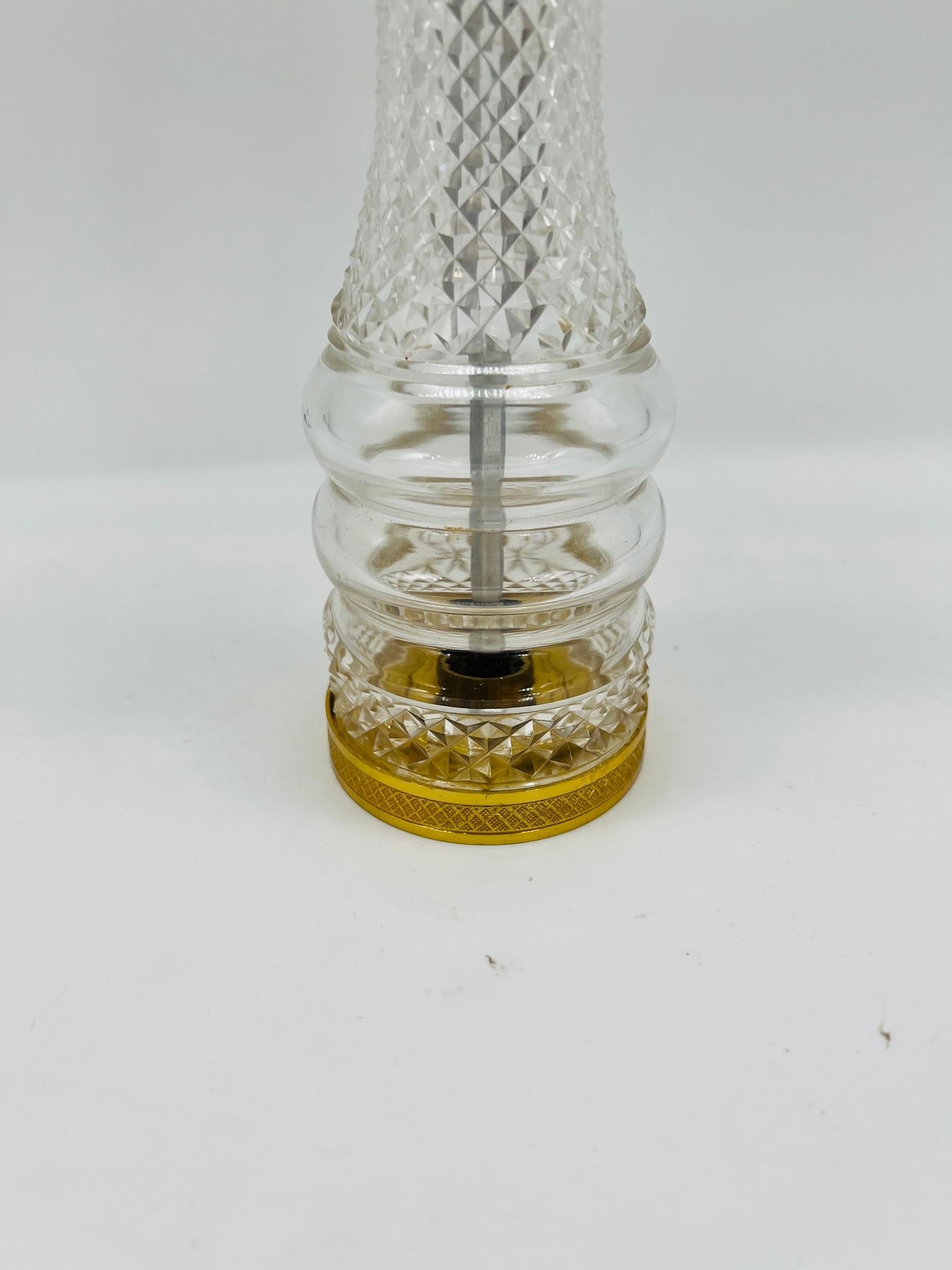 This exquisite French cut crystal pepper mill stands at an impressive 11.625 inches, showcasing both elegance and functionality. The body of the pepper mill is crafted from high-quality, intricately cut crystal, reflecting light beautifully through