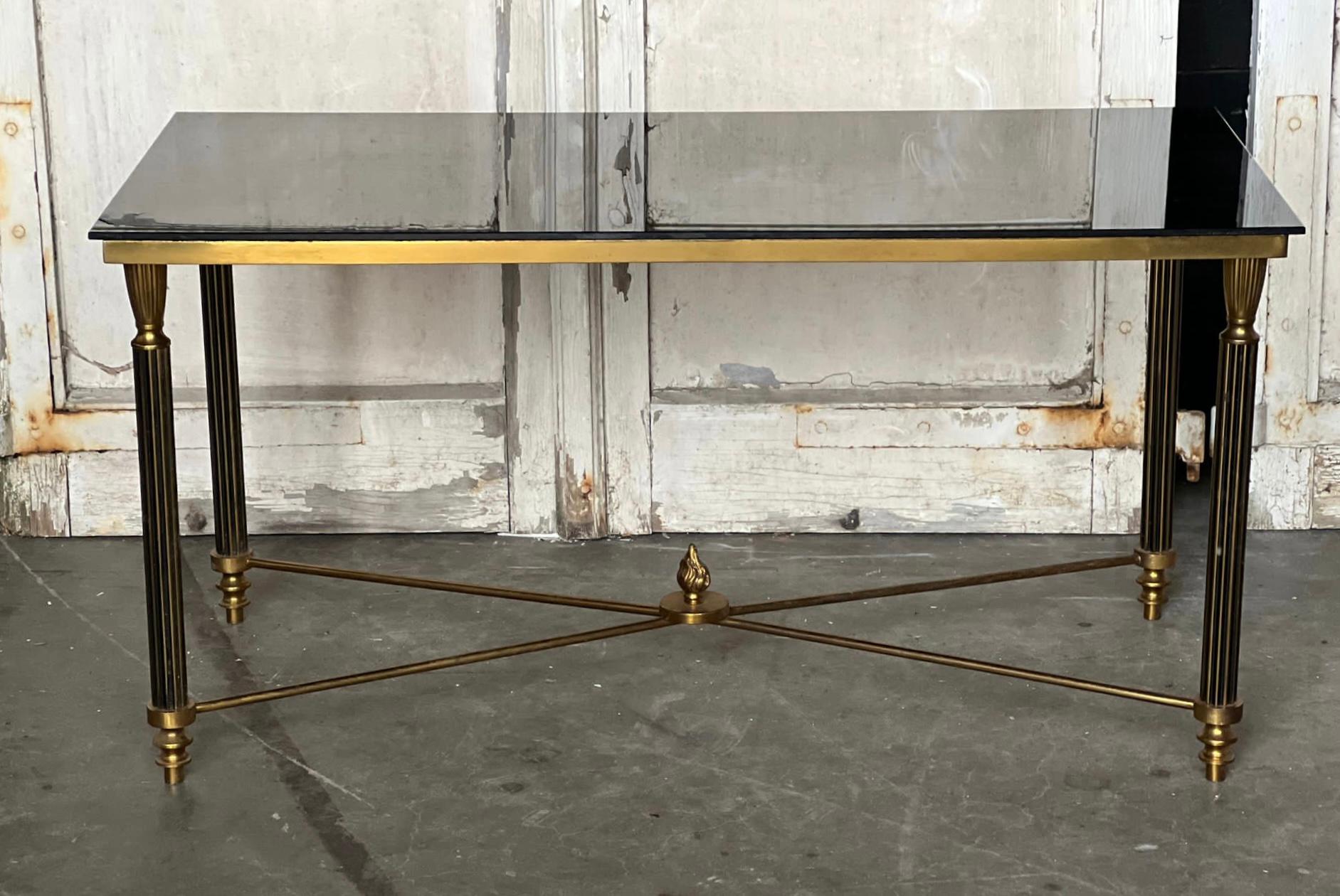 A very high quality French brass and glass coffee table. This came from a Parisian apartment and is in excellent original condition.
Measures: Width 95 cm
Depth 46 cm
Height 48.5 cm.