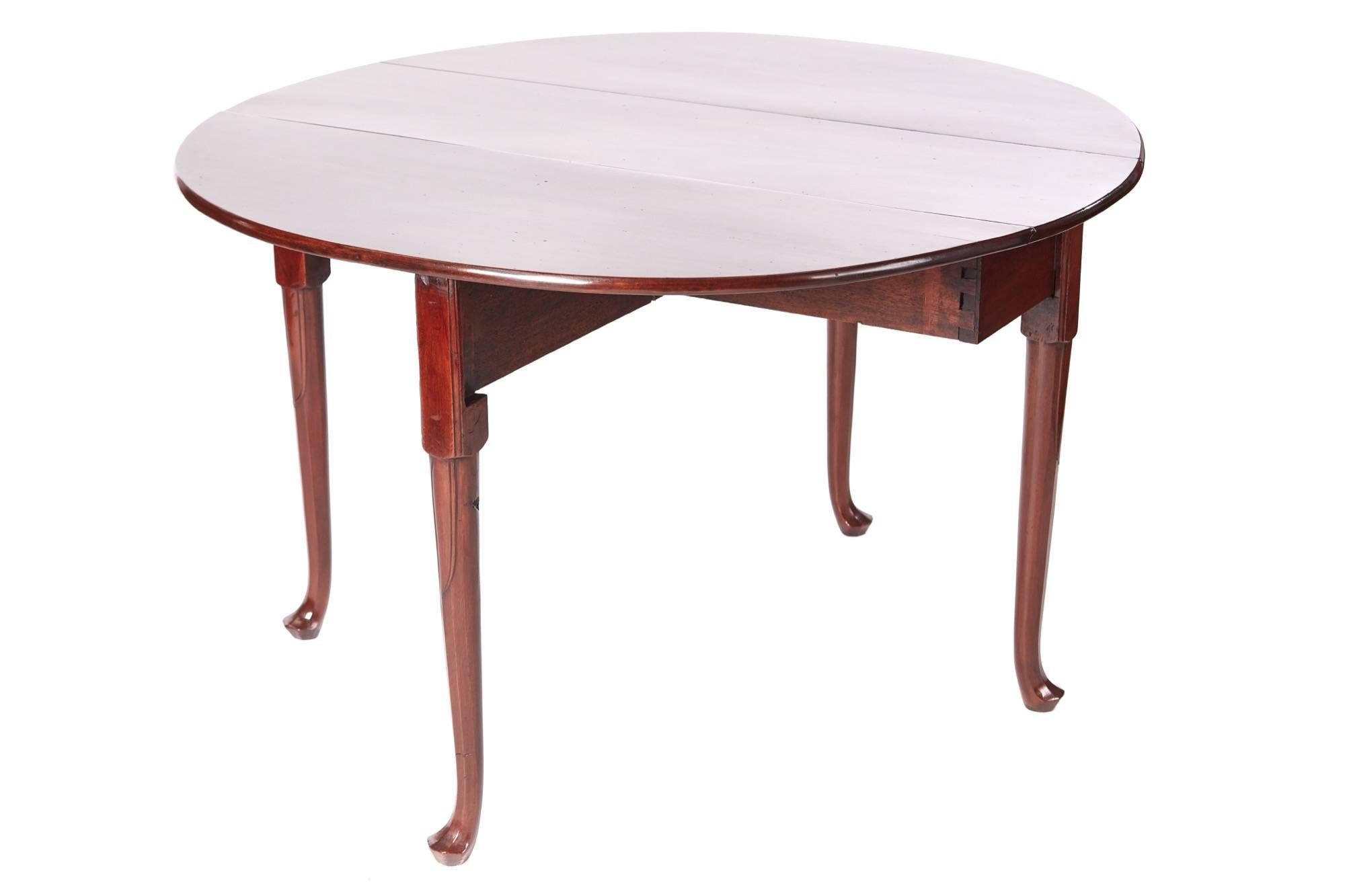 Quality george III mahogany dining table, having a fantastic solid mahogany top with two drop leaves, supported by four unusual turned legs with pad feet
Fantastic color and condition.