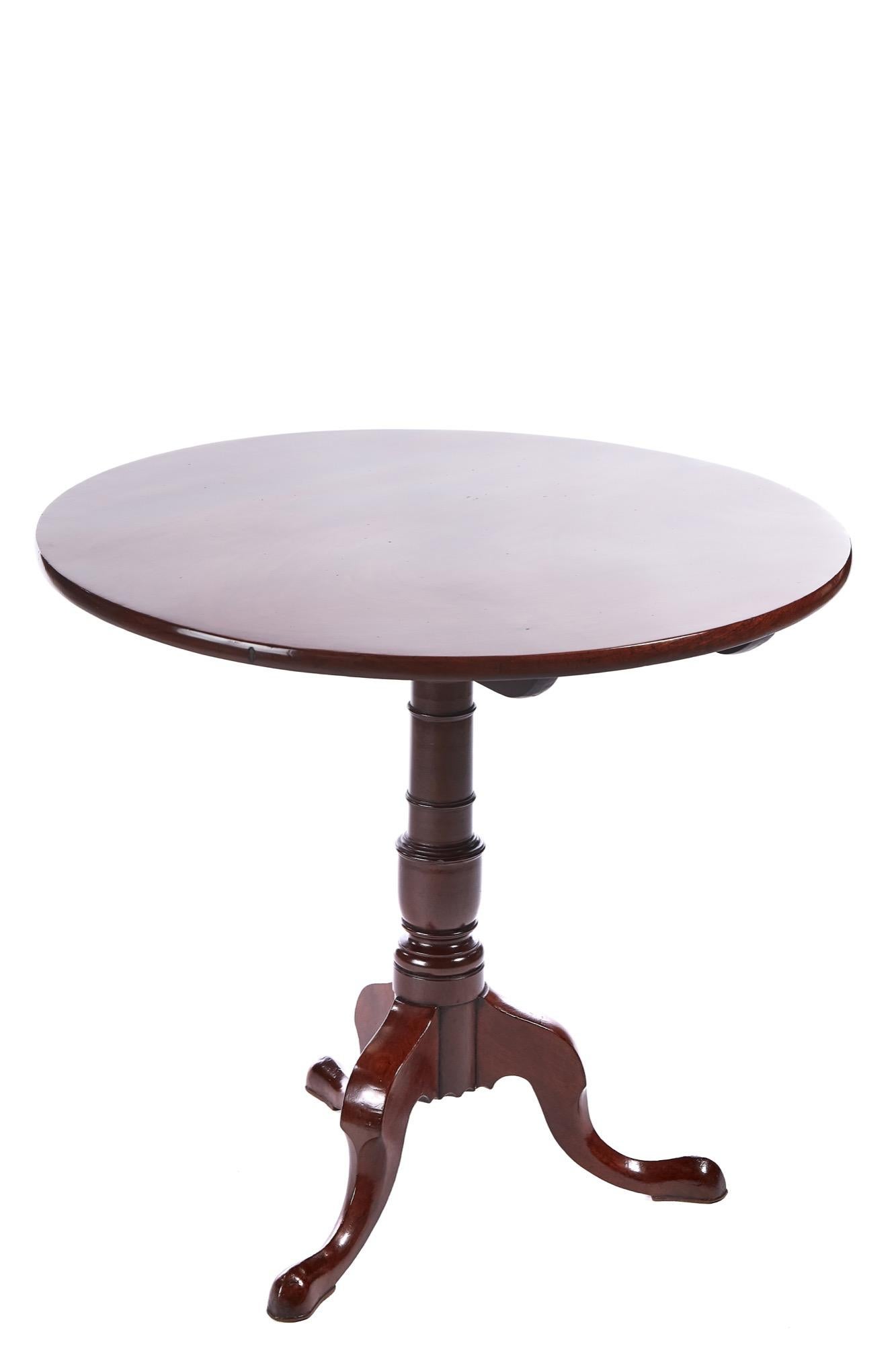 Quality Georgian mahogany round tripod table having a fantastic quality mahogany tilt top supported by a solid mahogany turned column raised on 3 shaped cabriole legs with pad feet.
Fantastic color and condition.
Measures: 30