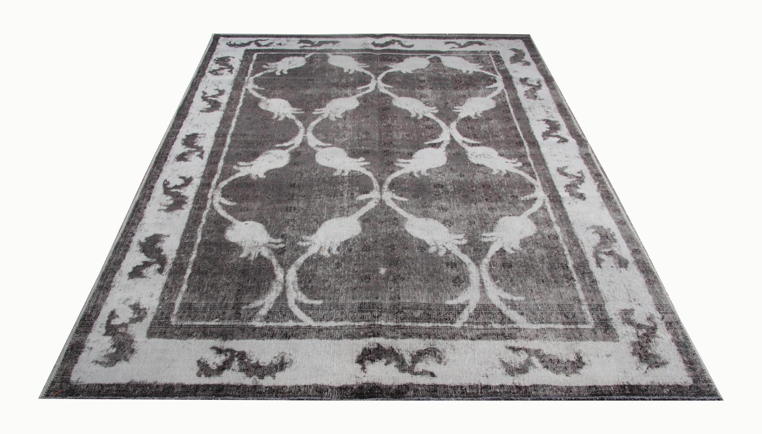Handmade carpet made using traditional handwoven techniques of the era this 1960s Oriental Turkish rug features a floral black and white pattern and would look great as both as a centrepiece or as a floor area rug. Made with high-quality organic