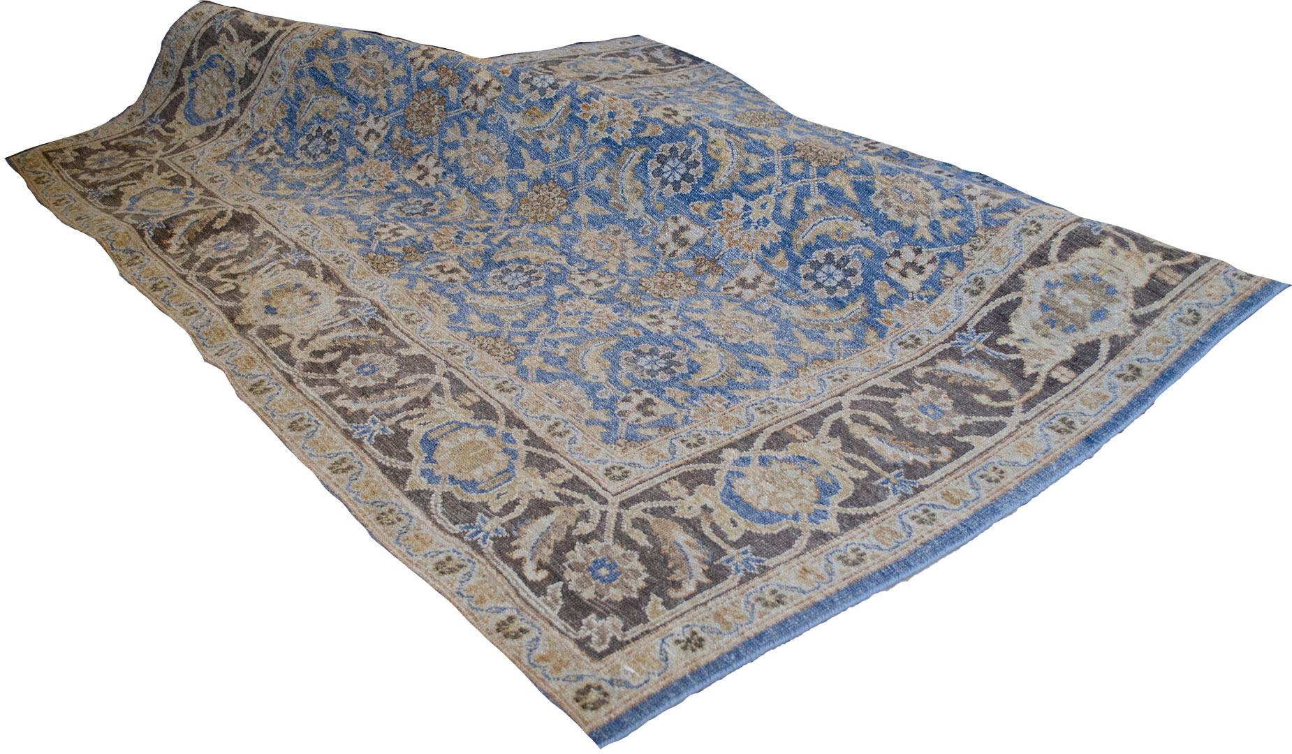 Truly one of a kind and extremely high quality Tabriz from Egypt featuring a breathtakingly decorative design and a soothing blue field color. 100% fine natural wool pile. Brand new.