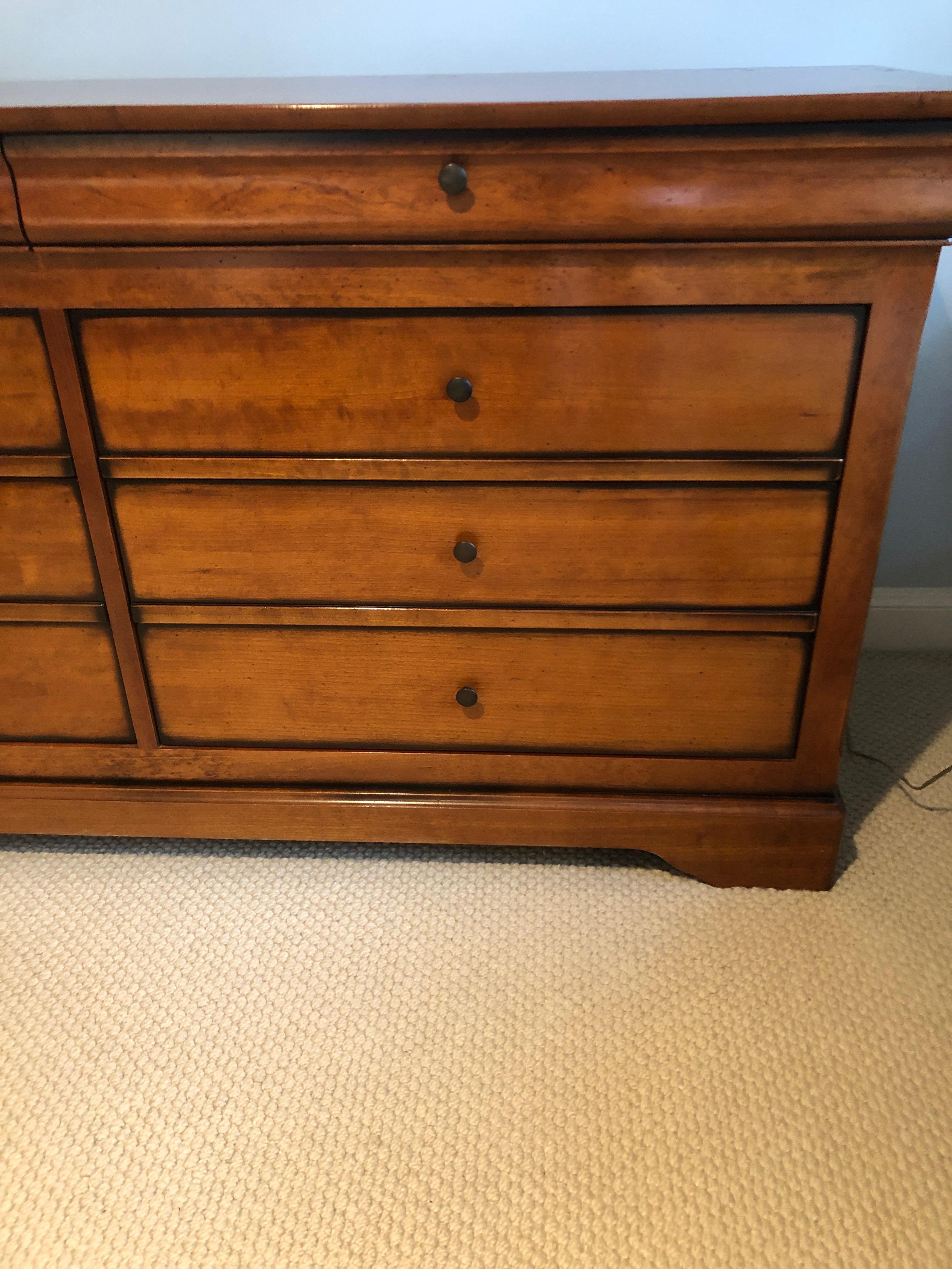 Beautifully made grange cherry dresser having two narrow drawers at the top with 6 roomy smoothly functioning drawers beneath. Made in France stamp and label on back.