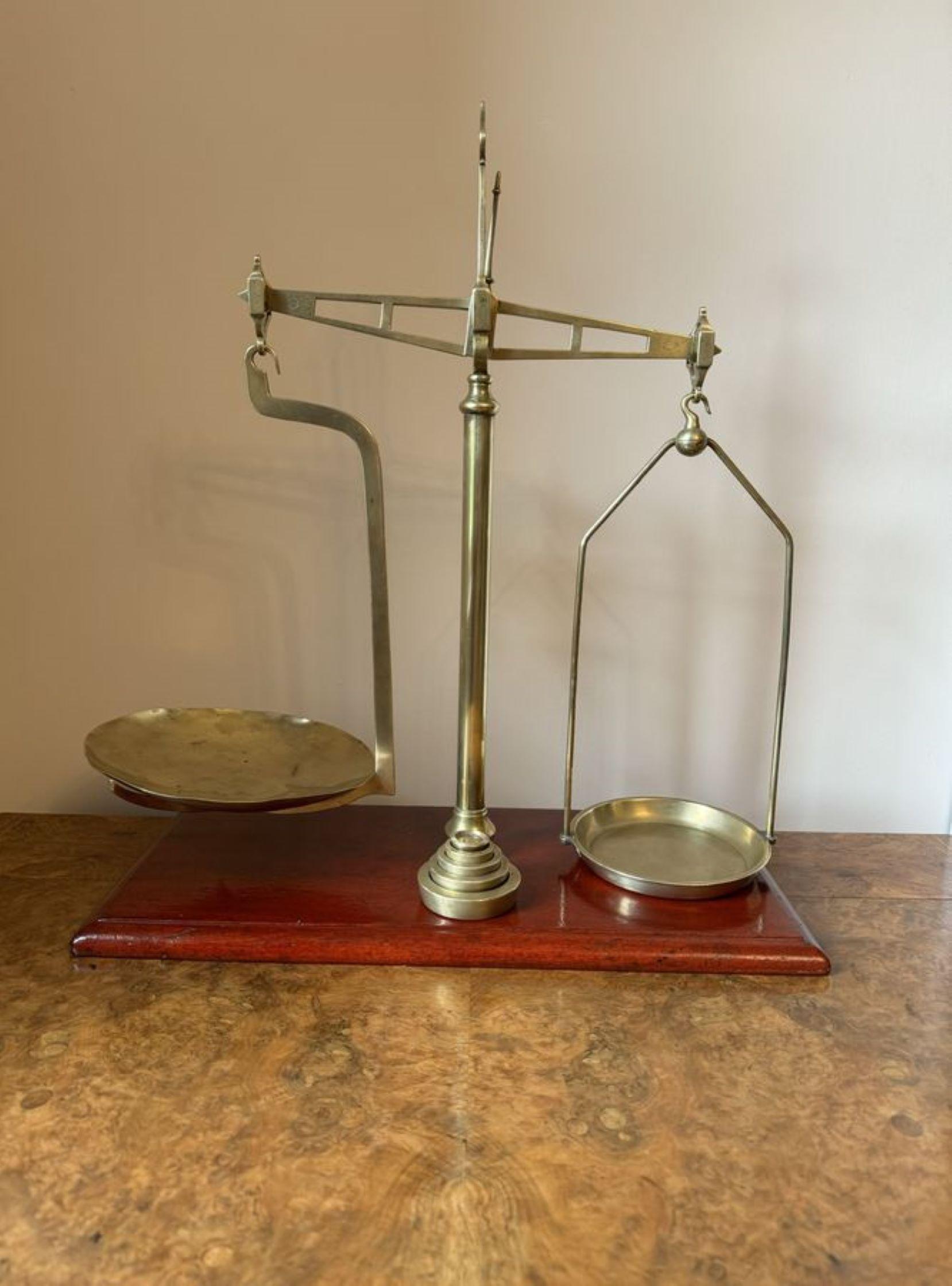 Quality large pair of Victorian scales by Parnall & Sons of Bristol, having a brass centre column mounted upon a wooden base, with a shaped brass arm holding brass weighing pans, Marked Parnell & Sons to the frame. Accompanied with a set of brass