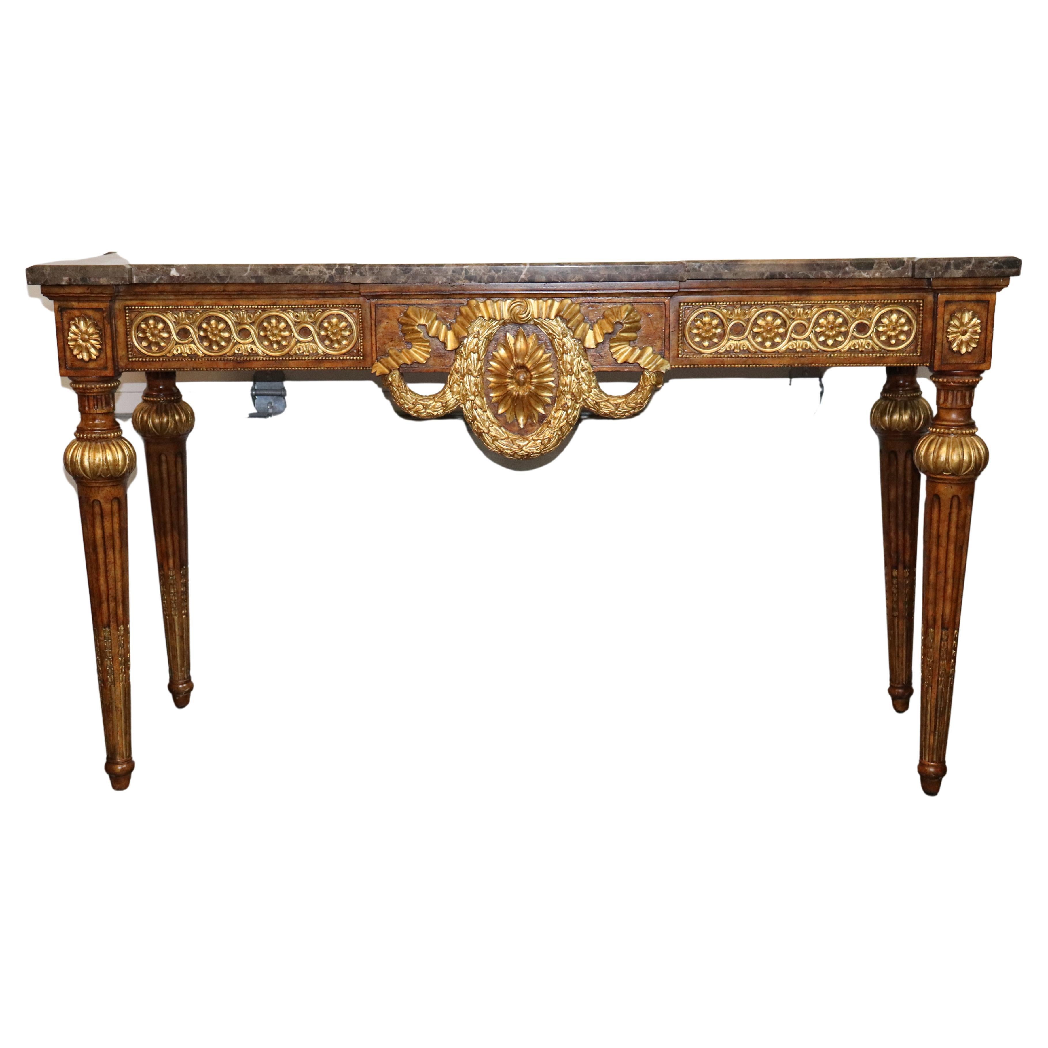 This is a gorgeous console table with a fantastic gilded and carved frame and even better marble top. The table is in excellent condition and so is the top. The table is 62 wide x 36.5 tall x 23 deep.
