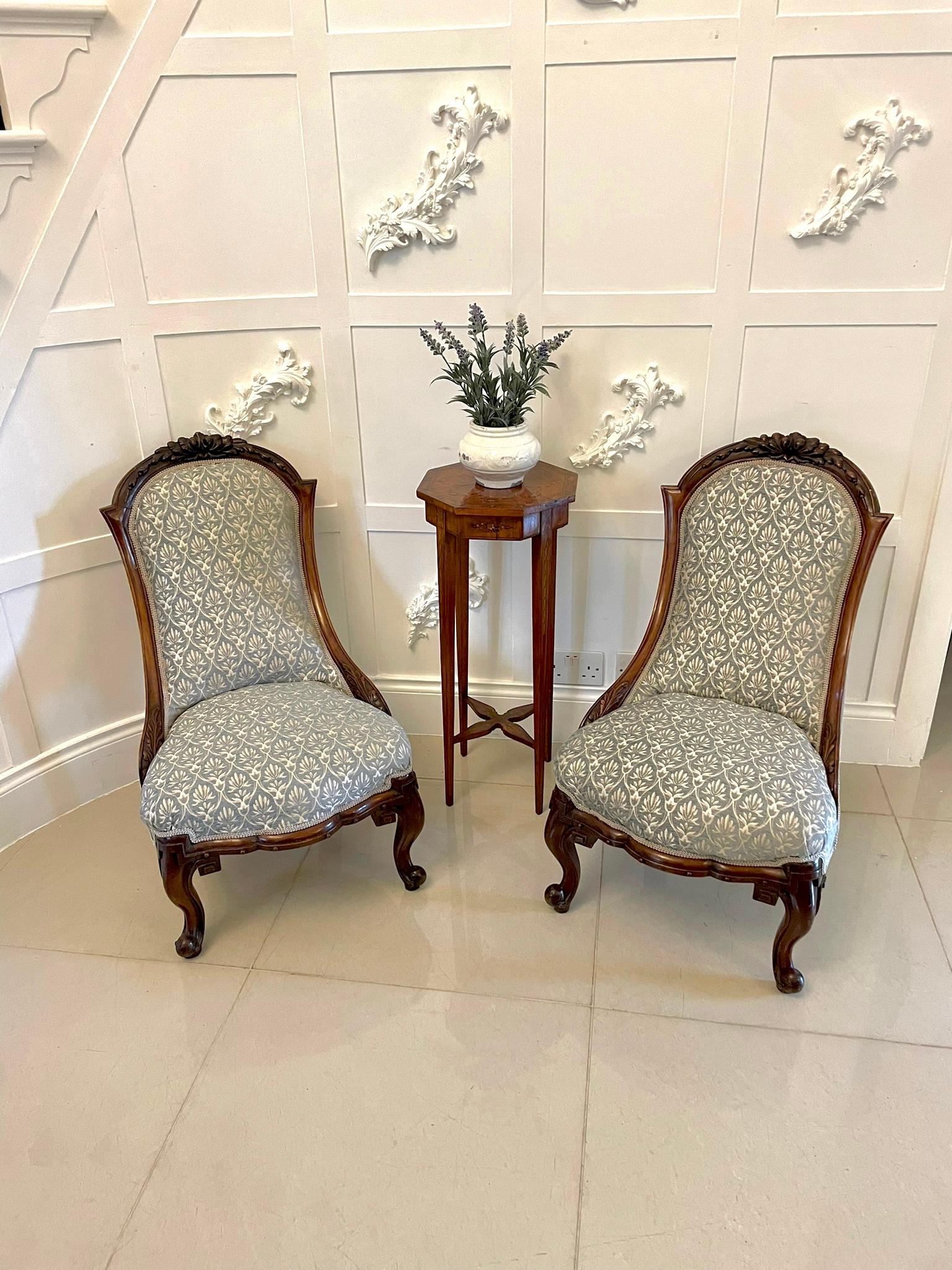 Quality pair of 19th Century Victorian antique carved walnut ladies chairs with elegant carved shaped top rails and shaped back and serpentine front rail. They are raised on elegant shaped cabriole legs to the front out swept back legs.

A very