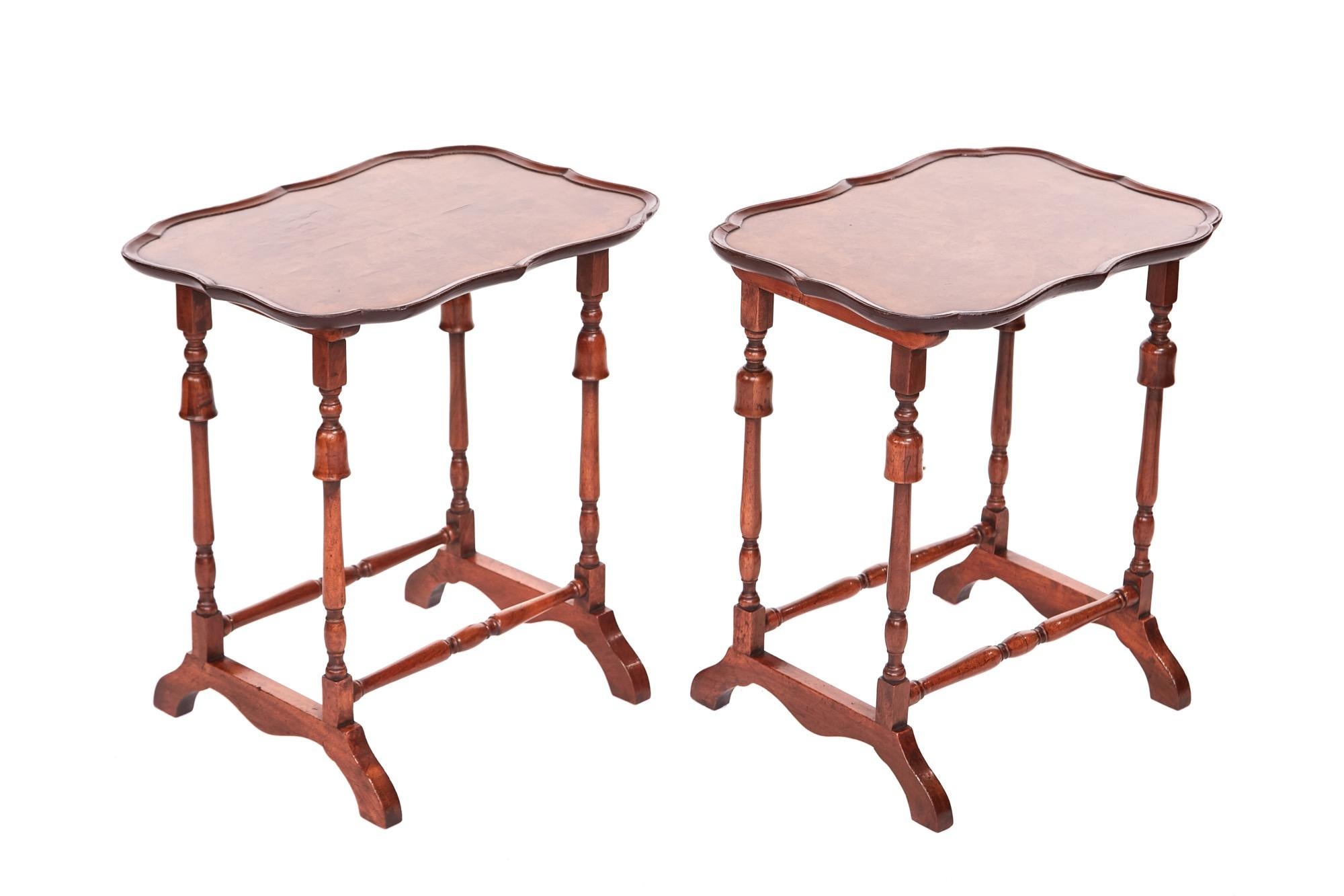 Quality pair of antique burr walnut lamp tables having lovely shaped burr walnut tops with a pie crust carved shaped edge supported by four turned legs with turned cross stretchers standing on shaped platform feet. Lovely color and