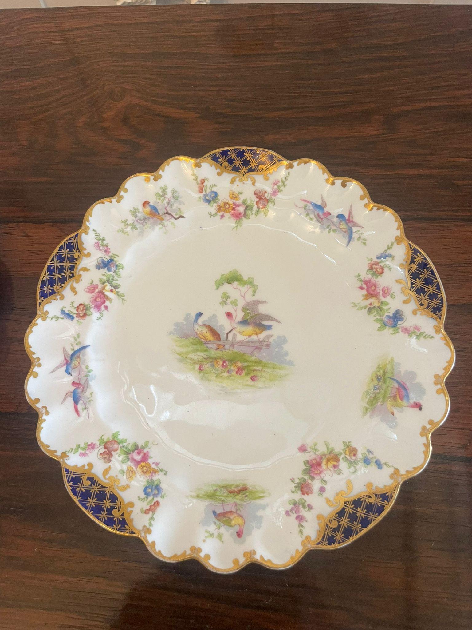 Quality antique hand painted Crescent china plates with fantastic quality hand painted decoration in red, pink, yellow, blue, green and gold colours 


Beautifully decorated in mint condition


Dimensions:
Height 2.3 cm (0.90 in)
Width 2.2 cm (8.66
