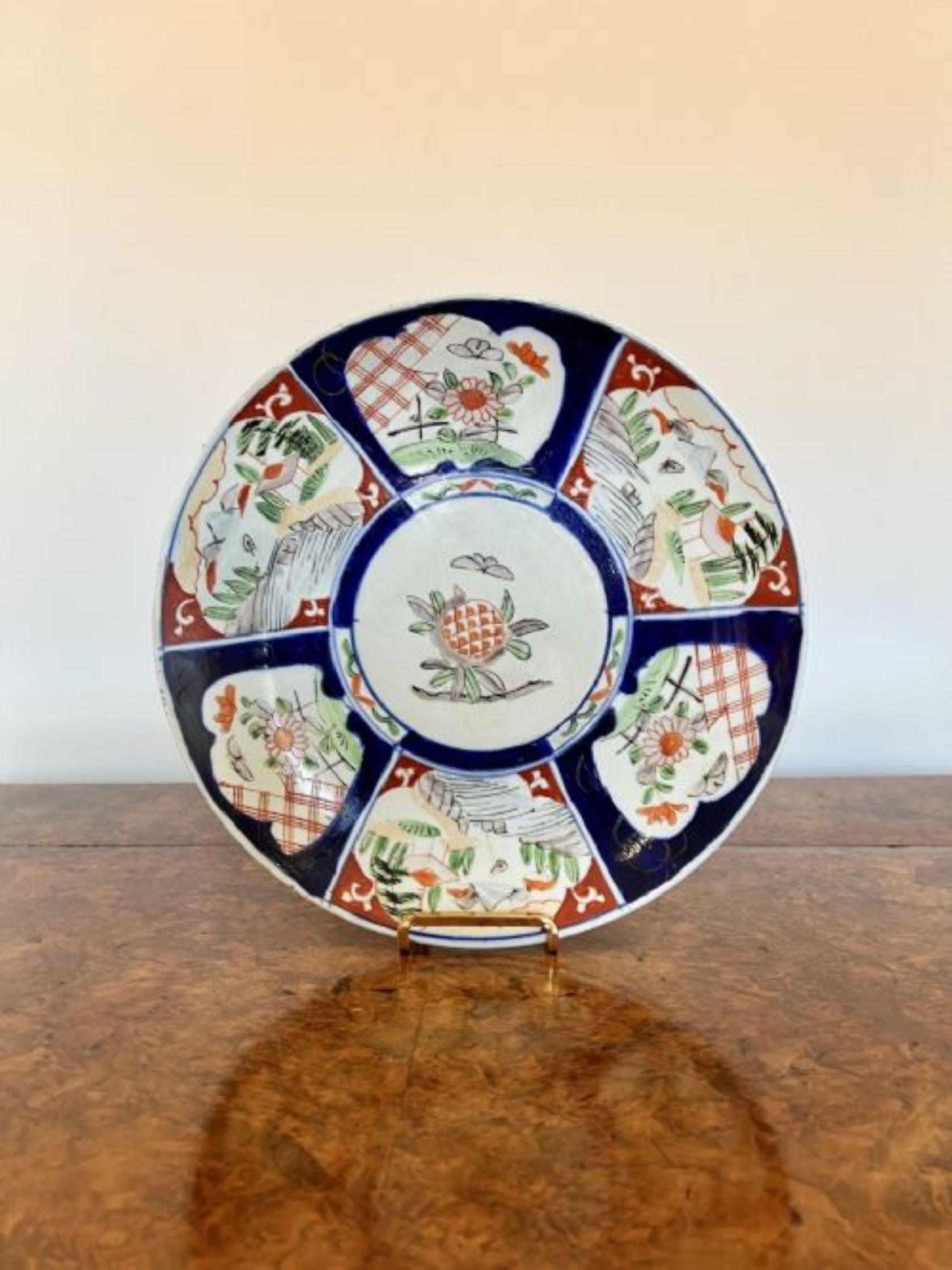 Quality pair of antique Japanese imari plates having a quality pair of imari chargers with wonderful decorated panels with flowers, leaves, trees and scenery hand painted in wonderful red, green, blue and white colours.