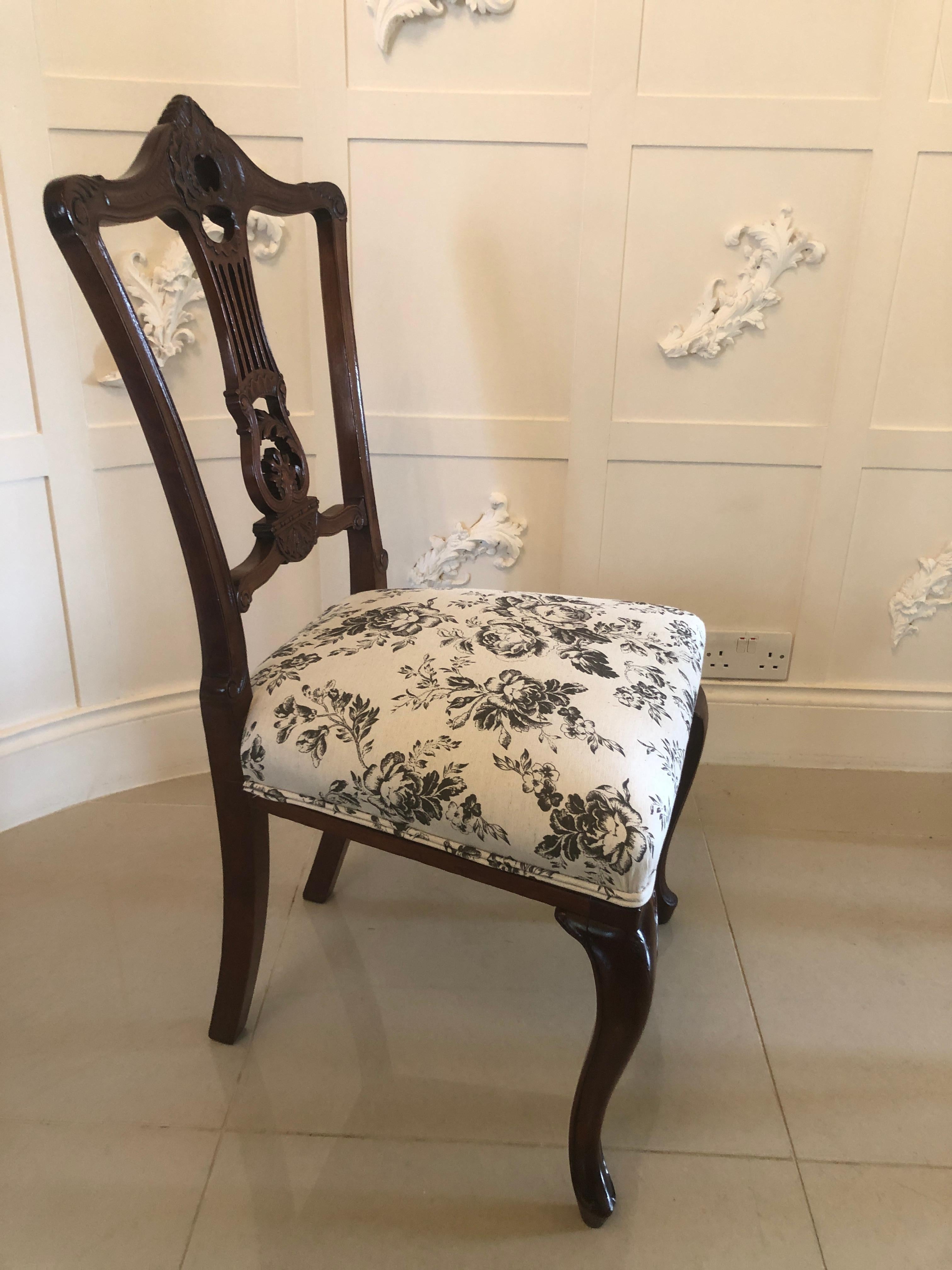 Quality pair of antique mahogany Victorian side chairs having very attractive expertly carved shaped tops with beautiful quality carved pieced splats to the centre. They stand on elegantly shaped cabriole legs to the front and outswept back legs.
