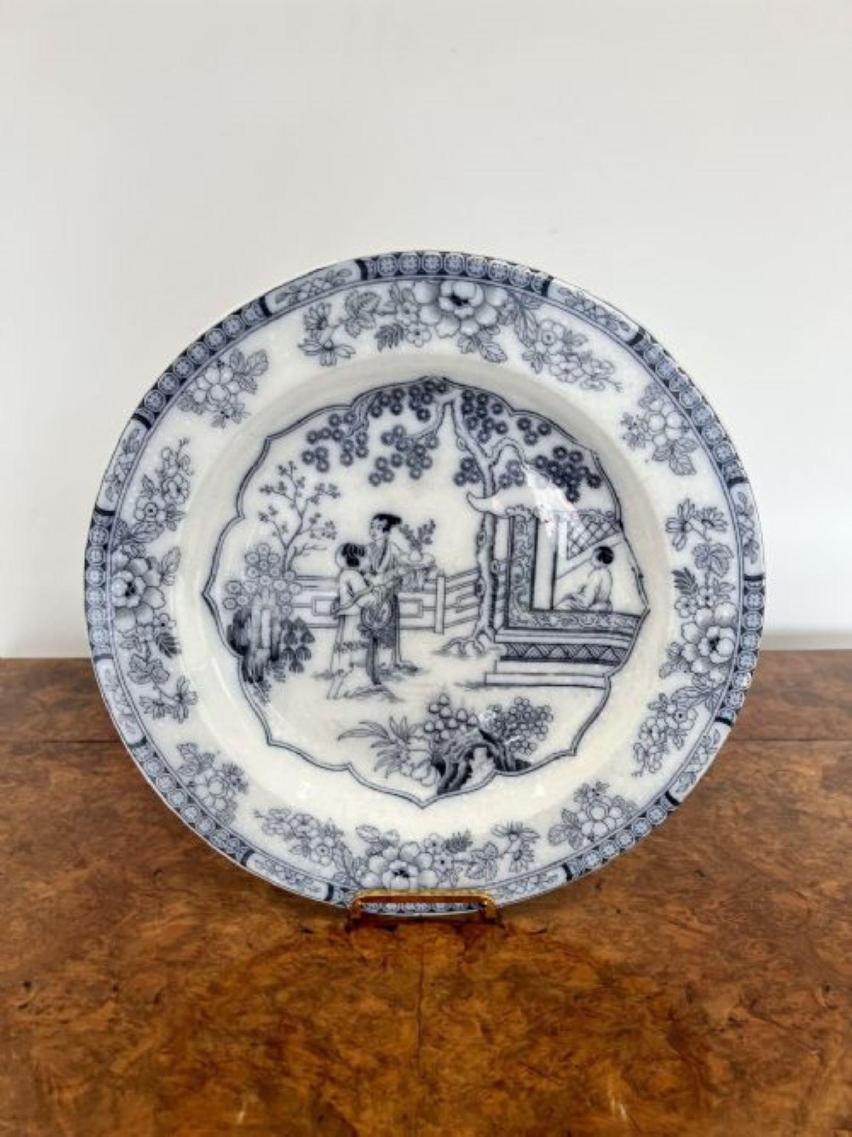 Quality pair of antique Victorian blue and white plates having a quality pair of antique Victorian chargers in Chinese style decorated with traditional scenes with willow trees, flowers and patterns. 