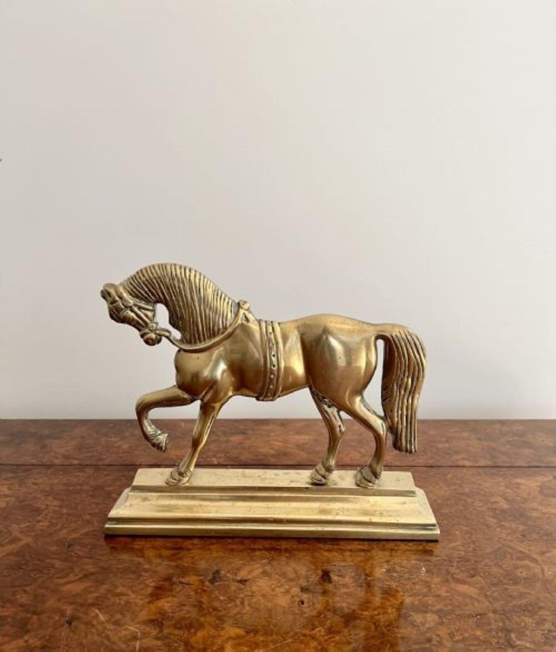 Quality pair of antique Victorian brass door stops depicting a fantastic solid brass model of a horse standing on a shaped brass moulded base.