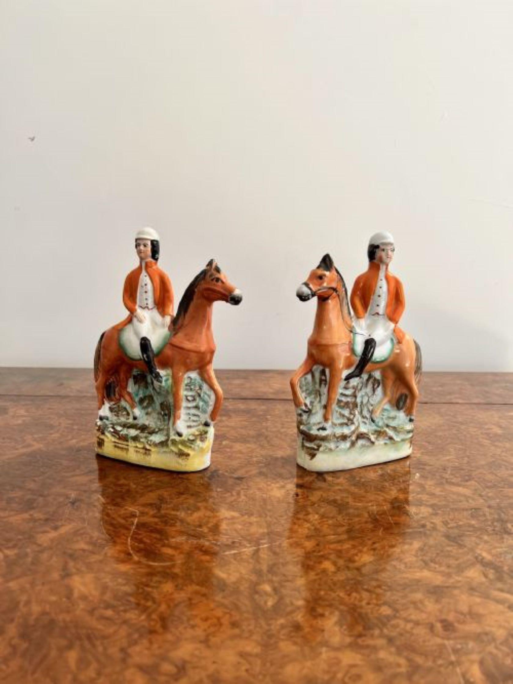 Quality pair of Antique Victorian Staffordshire figures having a pair of quality Victorian Staffordshire figures of two fox hunters on horseback going hunting, hand painted in wonderful brown, orange, white and green colours on a oval shaped base.  