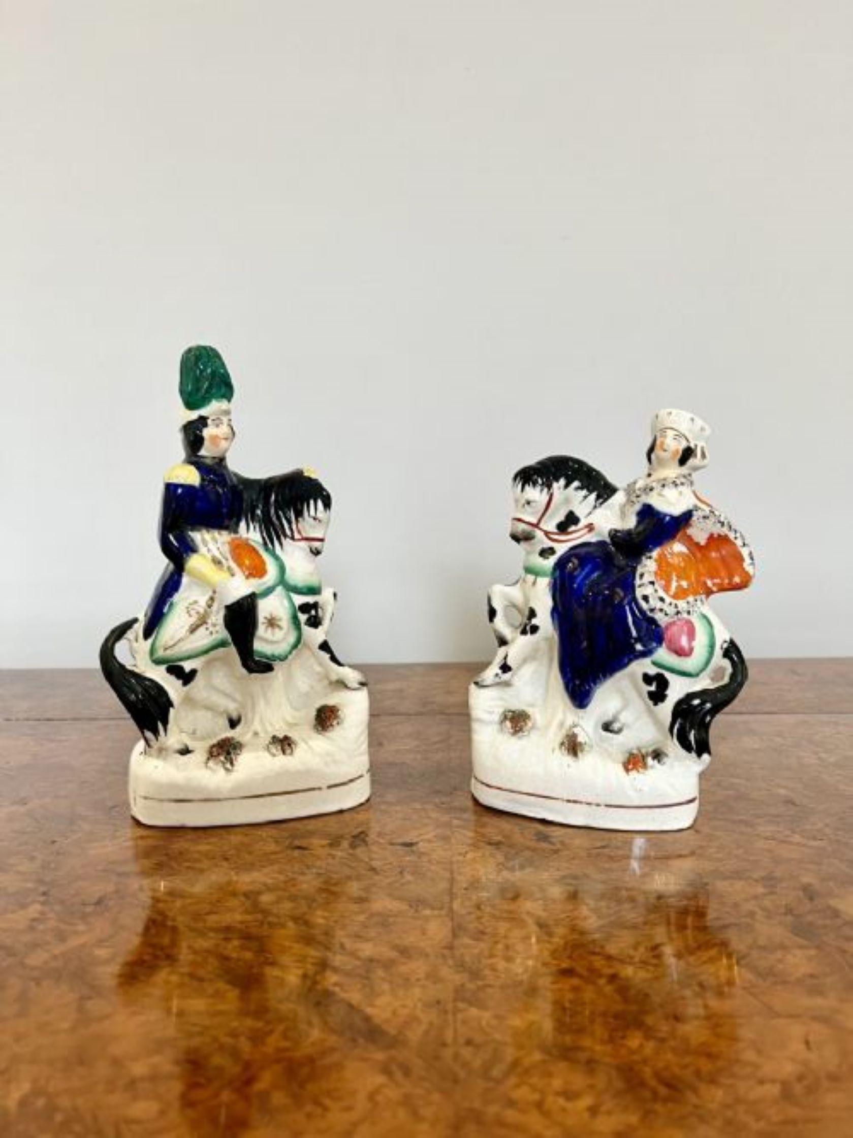 Quality pair of antique Victorian Staffordshire Royal figures having a quality pair of antique Victorian Staffordshire Royal figures of Prince Albert and Queen Victoria on horse back in wonderful blue, green, yellow, white, black and orange colours