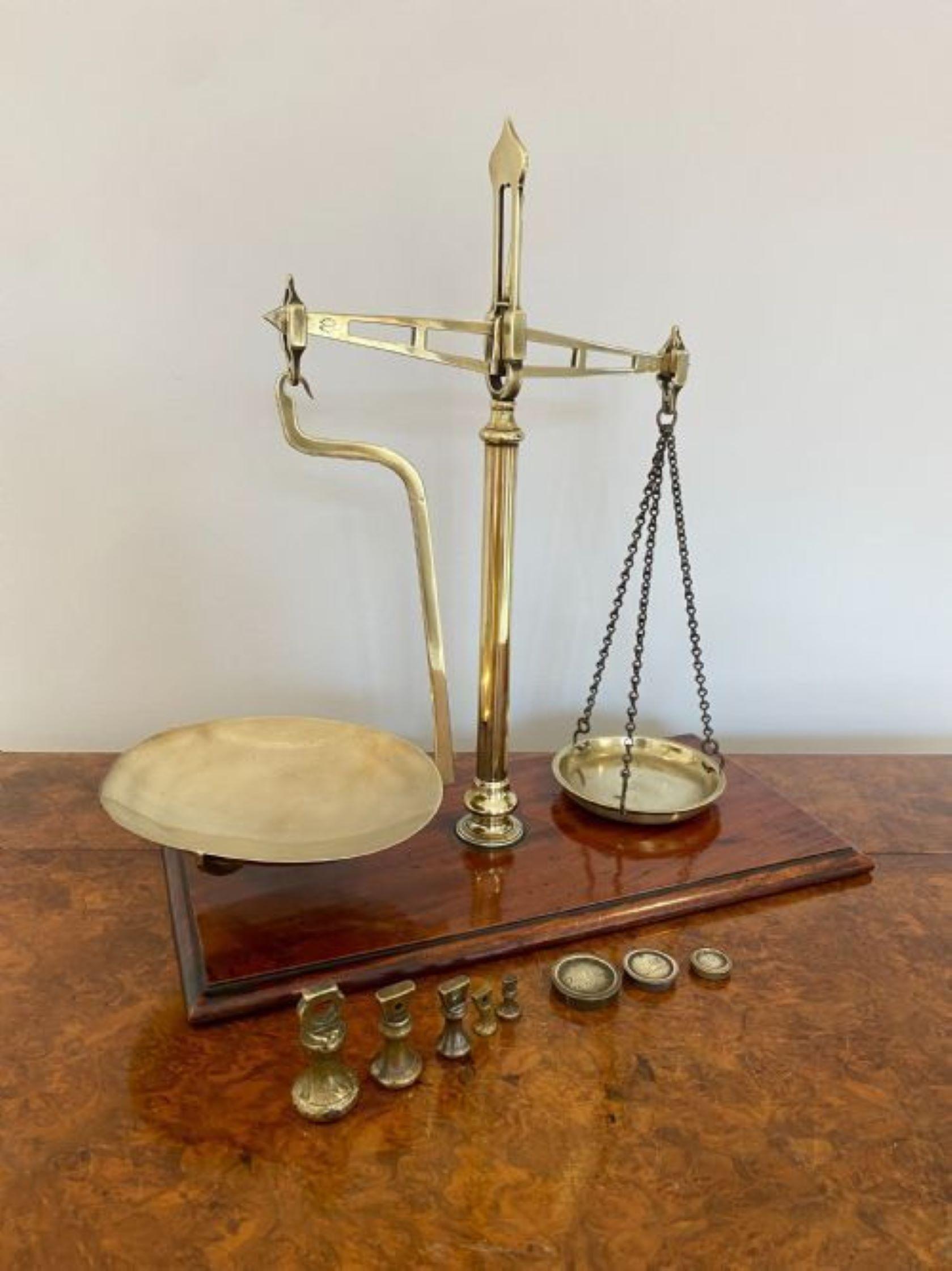 Quality pair of early Victorian 19th century Parnall & Sons of Bristol shop scales of brass construction upon a wooden mahogany base. Marked Parnell & Sons to the frame. Accompanied brass weights. 
