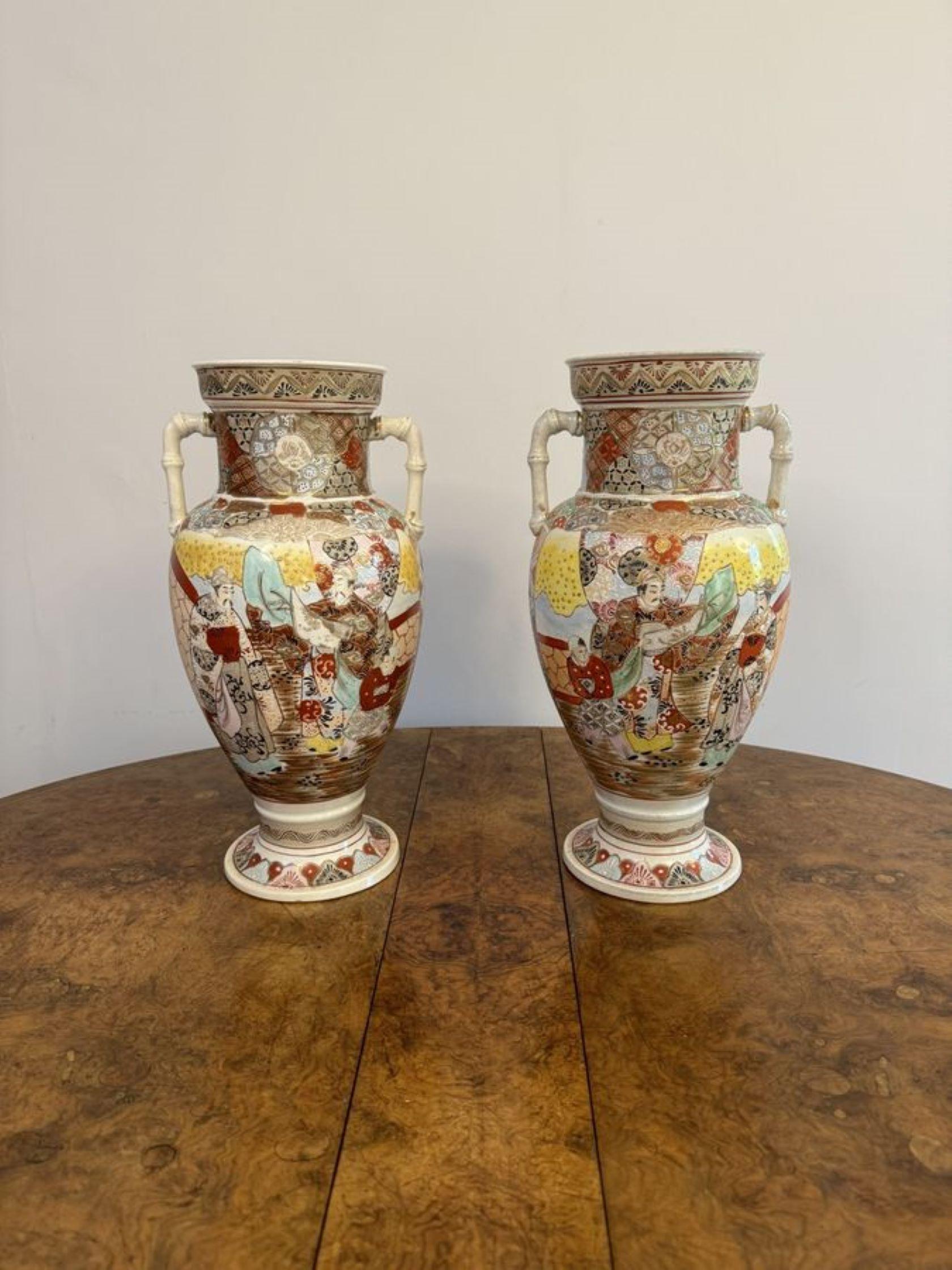 Quality pair of large antique Japanese satsuma vases, having a quality pair of large antique Satsuma vases with twin handles to the top, hand painted in stunning red, yellow, black, green, blue and gold colours raised on circular bases.

D. 1900
