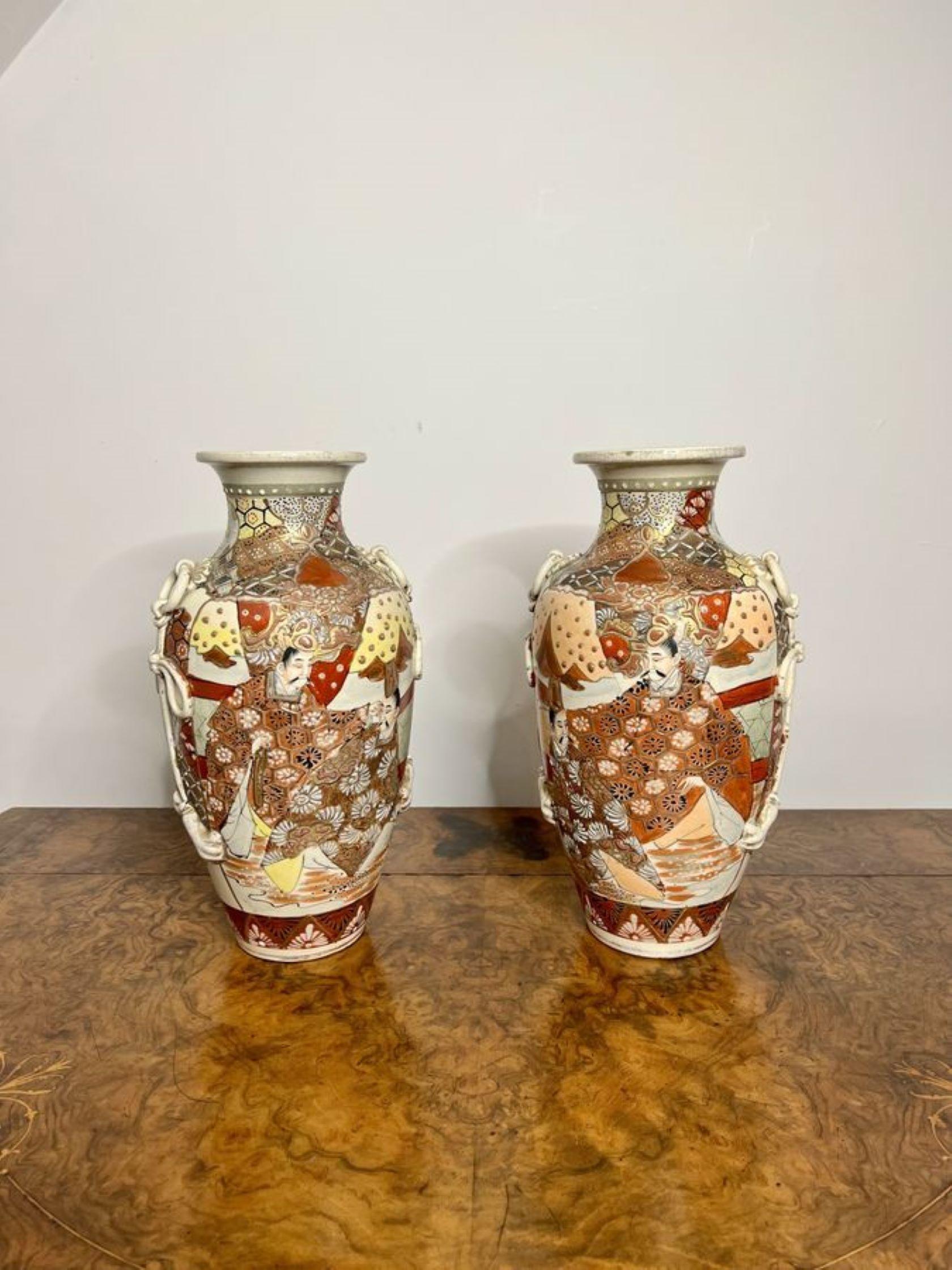 Quality pair of large antique Satsuma vases having a quality pair of large satsuma vases hand painted with wonderful decorated panels in red, yellow, black, blue and gold colours raised on circular bases.

D. 1910