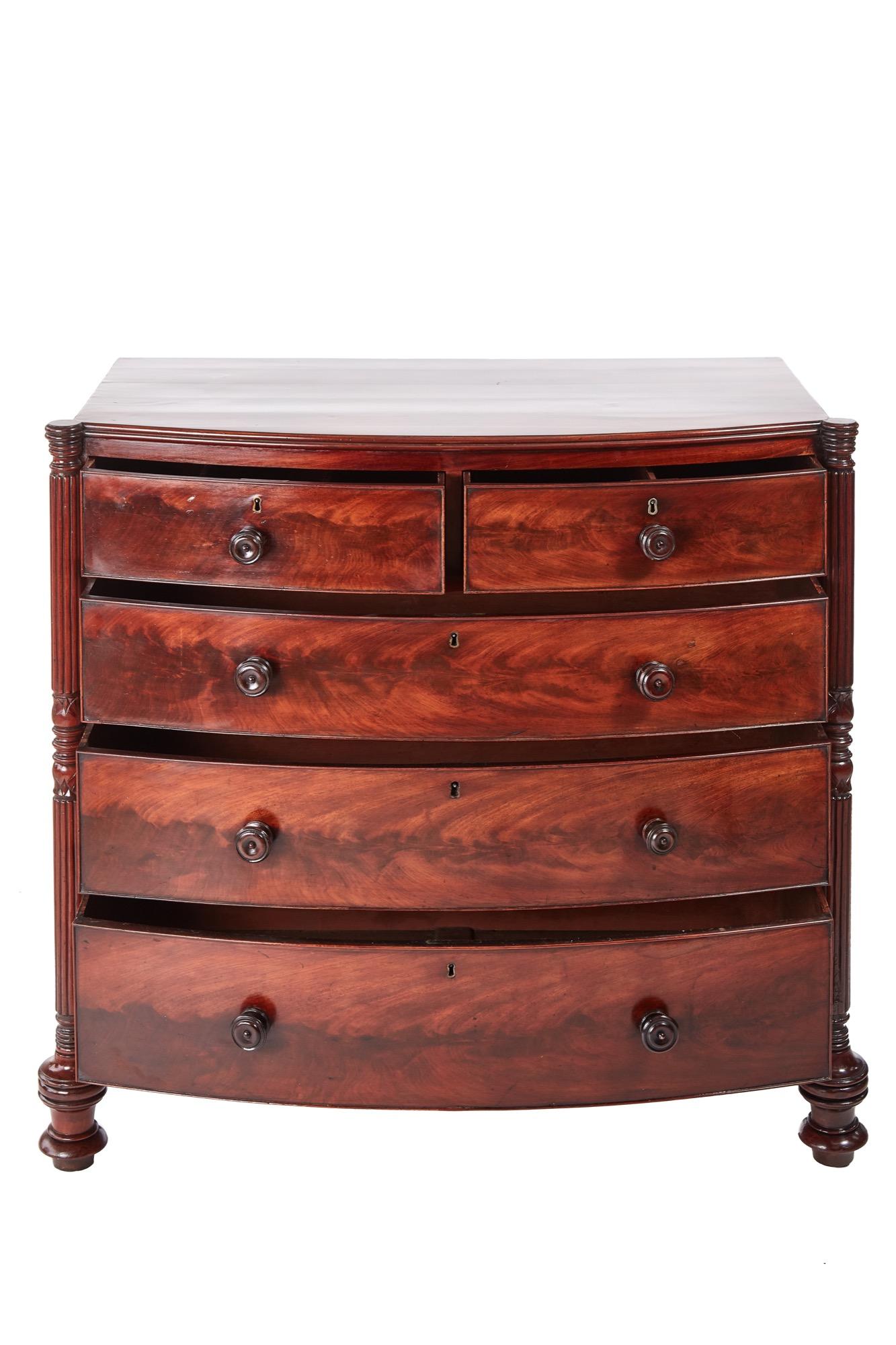 Quality Regency mahogany bow front chest of drawers, having a lovely mahogany top, two short and three long drawers with original turned mahogany knobs, lovely carved turned reeded columns, standing on turned feet
Lovely color and