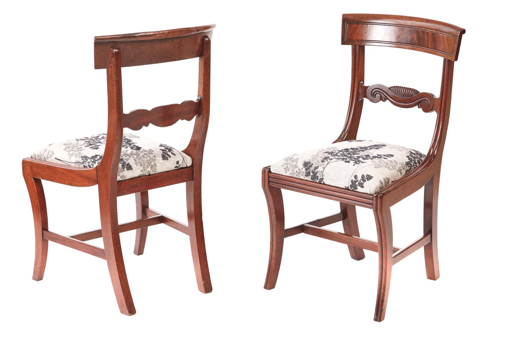 Quality set of four regency mahogany dining chairs,having a flame mahogany top rail with a reeded edge,lovely carved centre rail,newly re-upholstered drop in seats,standing on reeded sabre legs to the front outswept back legs united by mahogany