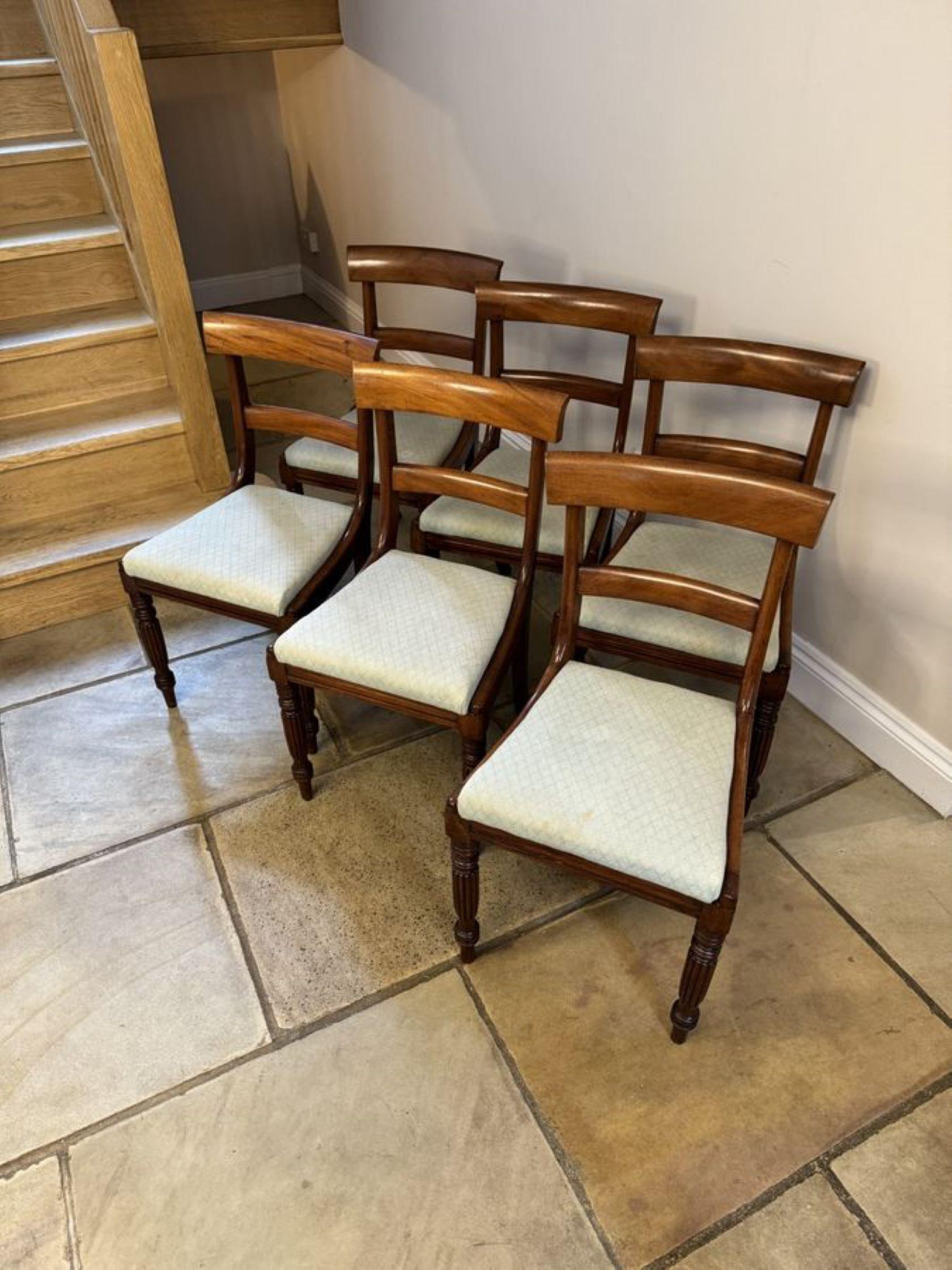Quality set of six antique Regency mahogany dining chairs, having a quality figured mahogany bar back drop in seats, standing on elegant reeded tapering legs to the front and out swept legs to the back.

D. 1830
