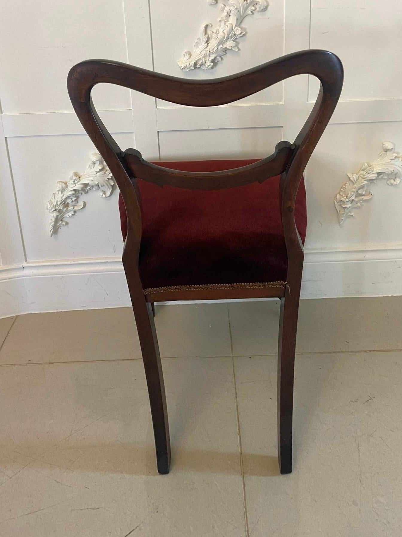 Quality set of six Antique Victorian rosewood dining chairs having a quality rosewood shaped back with a carved centre splat, newly reupholstered seats in a quality deep red velvet fabric standing on elegant turned tapering legs to the front and out