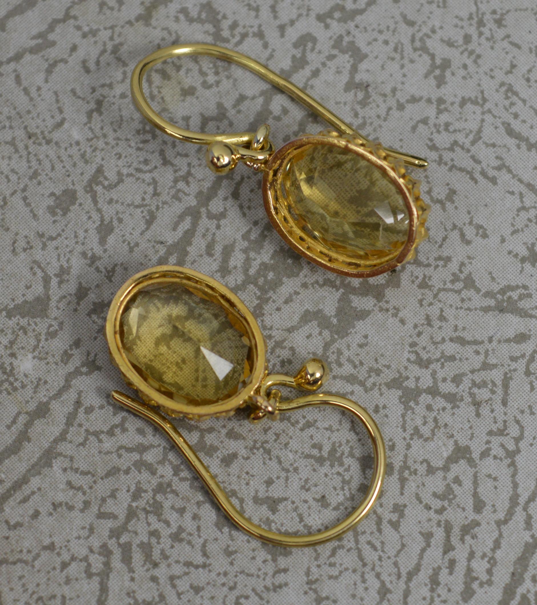 A superb pair of antique earrings, late Victorian c1880.
Solid 18 carat yellow gold multi claw settings and hook backs.
Each set with a single oval cut citrine.

CONDITION ; Very good for age. Clean and crisp. Issue free. Please view
