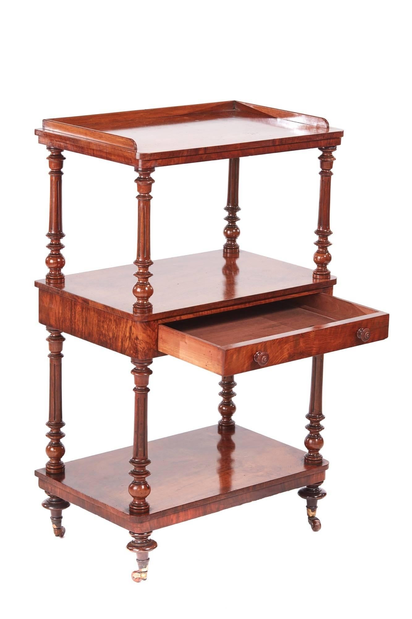 Quality victorian burr walnut three-tier whatnot, with three lovely burr walnut tiers and a gallery top, one drawer to the centre with original turned walnut knobs, supported by fluted turned uprights and turned feet, original castors
Fantastic
